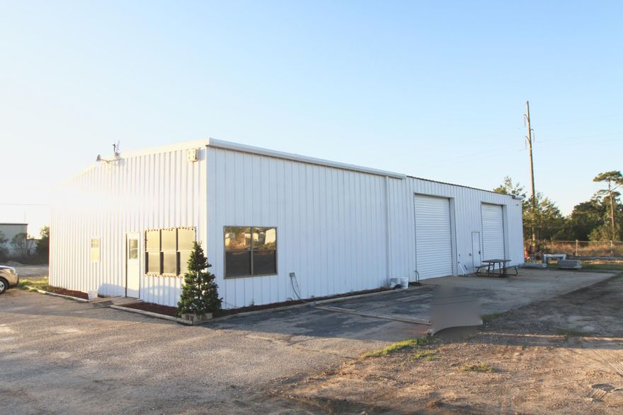 This is a great opportunity for any business that is in need of an office/ warehouse with and a large storage/ sales lot. This building consists of aprox 1000sf of office with 2000sf of warehouse space. The office space is made up of a lobby/ reception area two large offices, a smaller office/ copy room with both a men's & women's restroom. The 2000 sf warehouse has two 14ft roll up doors, skylights and 16ft eave heights. The property is 3.3 acres with great visibility and 370 front feet on Hwy 98.