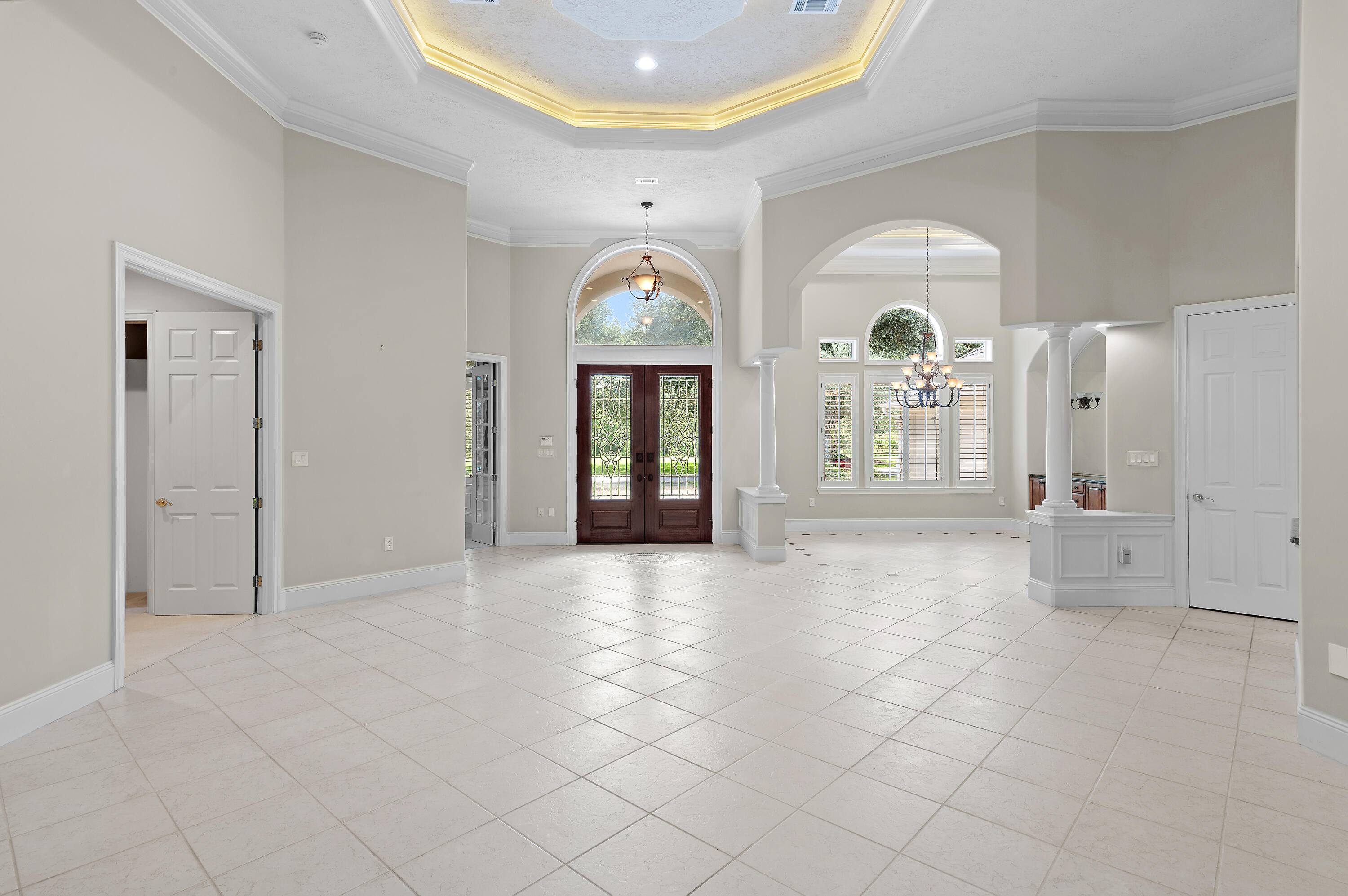JUST REDUCED $150,000! A NEW ROOF and NEW SCREENS were just completed on this exquisite three bedroom home with an additional office in the prestigious Stonebridge neighborhood of Kelly Plantation, which sits on a sprawling .58-acre corner lot, offering privacy, charm and exceptional amenities. With its stately stucco exterior, shingle roof and dedicated golf cart garage, the property exudes sophistication while providing ample space to add a pool or a semi-circular driveway for added convenience. Designed for both relaxed living and elegant entertaining, the interior features warm and inviting family spaces alongside a grand formal living and dining area. The kitchen is well-appointed with a spacious island, raised breakfast bar and KitchenAid appliances, all complemented by a neutral color palette that allows for effortless customization. Multistage crown molding, ceiling treatments and a deluxe lighting package add to the home's refined character. A gas fireplace in the living room is a cozy complement in the cooler months of winter. A highlight of the property is the expansive 802-square-foot screened porch, which along with the interior spaces, have a wired sound system and are perfect for enjoying Florida's beautiful climate year-round. Additional features include tile flooring, plush carpeted bedrooms, a paver patio and a central vacuum system. Additionally, this home faces a large park in the center of an oversized round-a-bout, so the front yard view and curb appeal is impeccable. Located within the gates of Kelly Plantation, residents enjoy championship golf, tennis, pickleball, a community pool, miles of walking trails and a private dock for paddleboarding and kayaking. The owners' clubhouse was recently remodeled, and this furnished space with outdoor grills is available for owners to reserve for private parties. Next door you will also find a fitness room and a separate yoga/pilates studio. Sports courts and 24-hour security complete this unparalleled lifestyle, with the beach, Whole Foods, Fresh Market and Destin Commons just a short golf cart ride away. Meticulously maintained by its current owners, this home offers an extraordinary opportunity to experience luxury living in one of Destin's most sought-after communities.