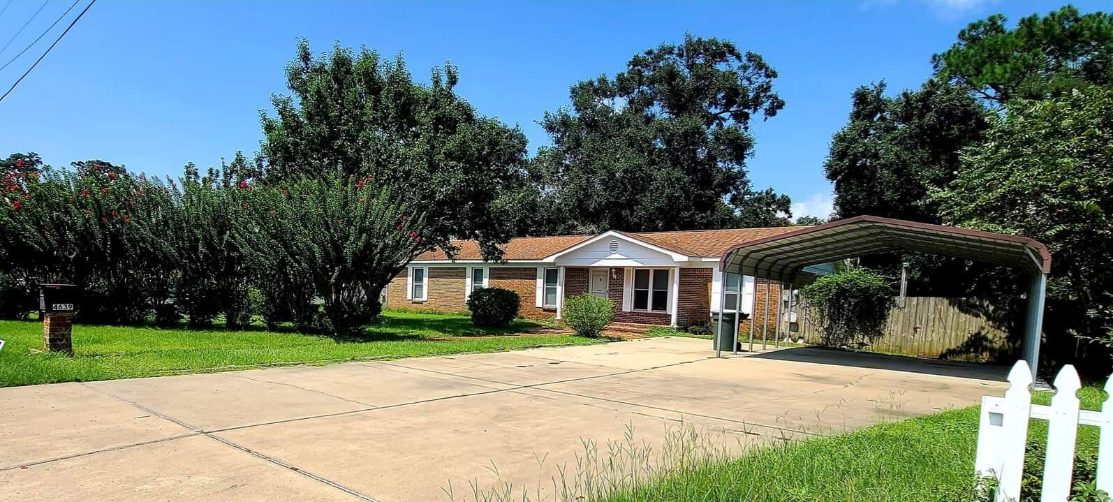 COME SEE...Beautifully remodeled home boasts 5 bedrooms & 2 full baths with new flooring and paint throughout. This open floor plan is ideal for entertaining large families. In the front enjoy lush green landscaping adding privacy & ample parking. The carport is designed for a RV with power hook ups and sewage. Walk out your screened Florida room to the back yard which is fenced and perfect for pets or kids with a big, detached shed. Massive laundry area includes working bench with shelves and storage galore. With 2 attic spaces you'll never run out of storage. A bonus workshop in the back of the house includes a dedicated welder breaker box. Location is key! Walmart and tons of restaurants and shopping just a few steps away. No car needed! 6 Night Owl security cams included (3 installed).