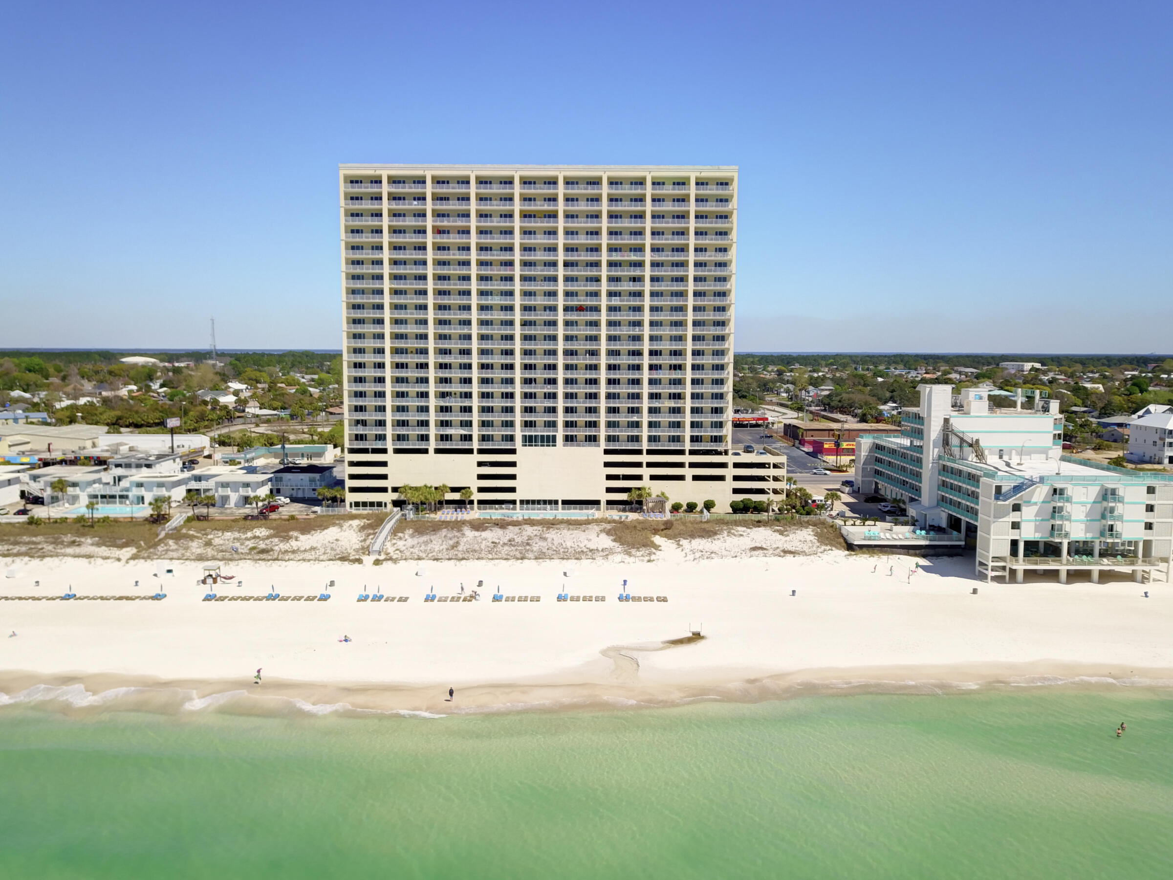 Discover luxury living in this stunning 4-bedroom, 3-bathroom Gulf-front penthouse at the prestigious Ocean Reef. Perfectly situated on the east end corner, this condo offers unparalleled panoramic views of the emerald waters and sugar-white sands. Step inside and be greeted by soaring 10-foot ceilings and elegant 8-foot door frames, creating an open, airy ambiance. The spacious floor plan seamlessly blends comfort and sophistication, with plenty of room for family gatherings or entertaining guests. Features include: Expansive, 10'x28' Gulf-front balcony with breathtaking sunrises and sunsets, generously sized bedrooms, including a luxurious primary suite on the Gulf with balcony access, Floor-to-ceiling windows that flood the condo with natural light and the most beautiful Gulf views. Located in the heart of Panama City Beach and only 1.2 miles East of Pier Park, Ocean Reef offers premium amenities, including a Gulf-front pool, fitness center, steam room, sauna, hot tub, and private beach access. Plus, this condo includes an assigned, deeded parking space underneath the building. This is more than a condoit's your slice of paradise. Don't miss the opportunity to make this penthouse your coastal retreat!
