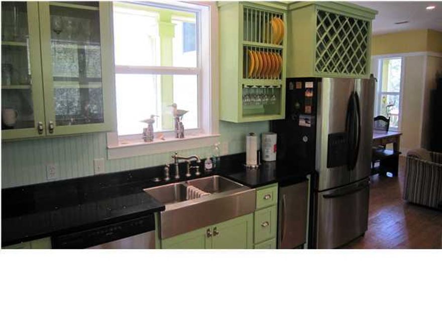 This cool beach house brings in more than $50,000 in vacation rentals consistently. It is South of 30A, and so close to the water that you can walk to the dazzling white beaches of the Gulf of Mexico in 3-5 minutes ! With bright, colorful decor and the generous use of painted horizontal wood paneling and bead board, the feeling is comfortable and casual, but it is really big, too. All four bedrooms feature custom built in closet-cabinets and there is a deck or porch opening from all three floors to expand your living space even more. The ceilings are 10 feet tall, and all the floors are hardwood, except for the bathrooms. There is counter space galore in the spacious kitchen on the first floor, with all stainless steel appliances and sparkly stone counter tops. In addition to the over