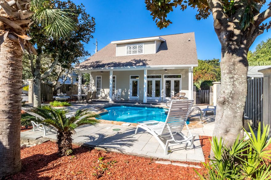 This beautiful and spacious Crystal Beach Florida Cottage sits on a corner lot just one block from the emerald green gulf waters. Enjoy your private gated courtyard with beautiful Florida foliage, covered porch, and plenty of room for outdoor dining and recreation. Sit in the courtyard and listen to the waves crash as you relax next to your private pool. The interior features a living area overlooking the courtyard pool with double French doors, main kitchen with breakfast bar, center island, eat-in dining area and built in shelving. The master bedroom is on the main level with tray ceilings, and tons of natural light. The master bathroom offers dual vanity, jetted tub, and separate shower. 3 bedrooms are upstairs with a full bath, one of the bedrooms is a bunk room. There is a separate living/kitchen area with 2 more bedrooms. This home is able to accommodate large families easily. The property is a considerable investment opportunity, as this large 6 bedroom 5 bathroom home has proven rental history of approximately $100k gross annual revenue. Seller uses the short time in between the busy summer and fall booking seasons for repairs and maintenance -- most recent improvements include: a new pool liner, updated guest bathroom off main living area, new deck off the back of the home, new landscaping, and pressure washing. The property is ready for it's heavy fall bookings!! Call me today for your private tour!