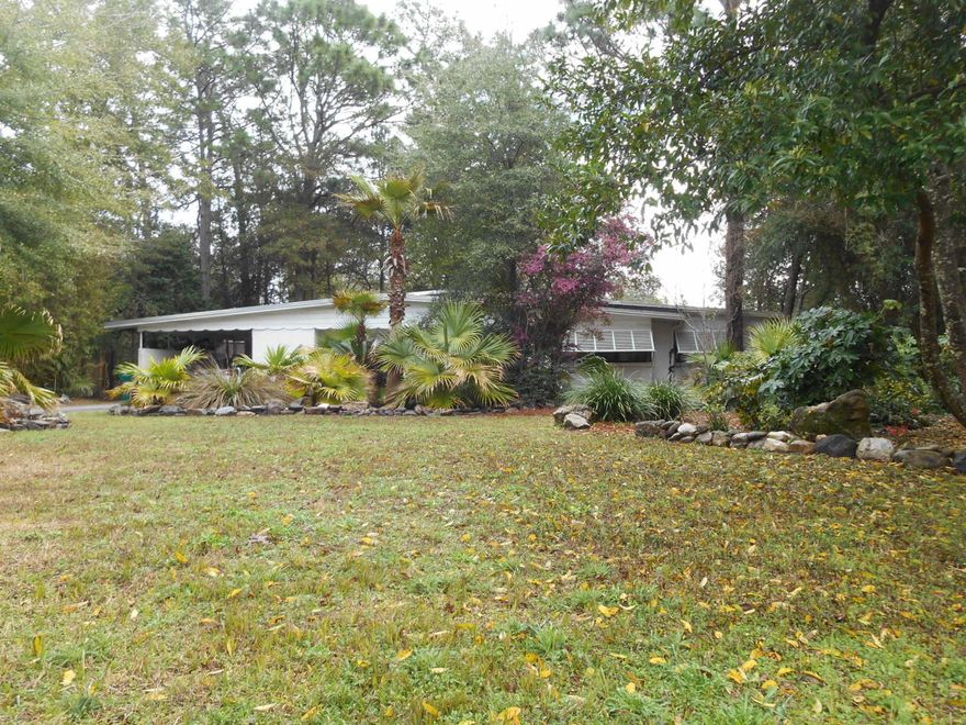 Come and check out this YesterYear FLORIDA COTTAGE on this Large Private Corner Lot with Many Plants, Shrubs and Trees that keep your Home COOL during the Hotter months. The Storm Resistant Block construction is covered with attractive stucco & the Home has Old Florida style metal Storm shutters for ADDED Storm protection. The Back yard has a screened in covered Patio & an open patio to enjoy the out doors! Note the NEW Large hurricane strapped yard building. This Home Now has a renovated Kitchen with new Cabinets, Granite, Stainless Appliance, Sink & Flooring. ALSO NEW ARE; Gas Hot Water Heater, Ceiling- Light Fixtures & Fans, Carpet in the living room, Hallway & bedrooms (terrazzo flooring underneath), (3) exterior doors, Master bath has a total remodel, Hall bath vanity & flooring.