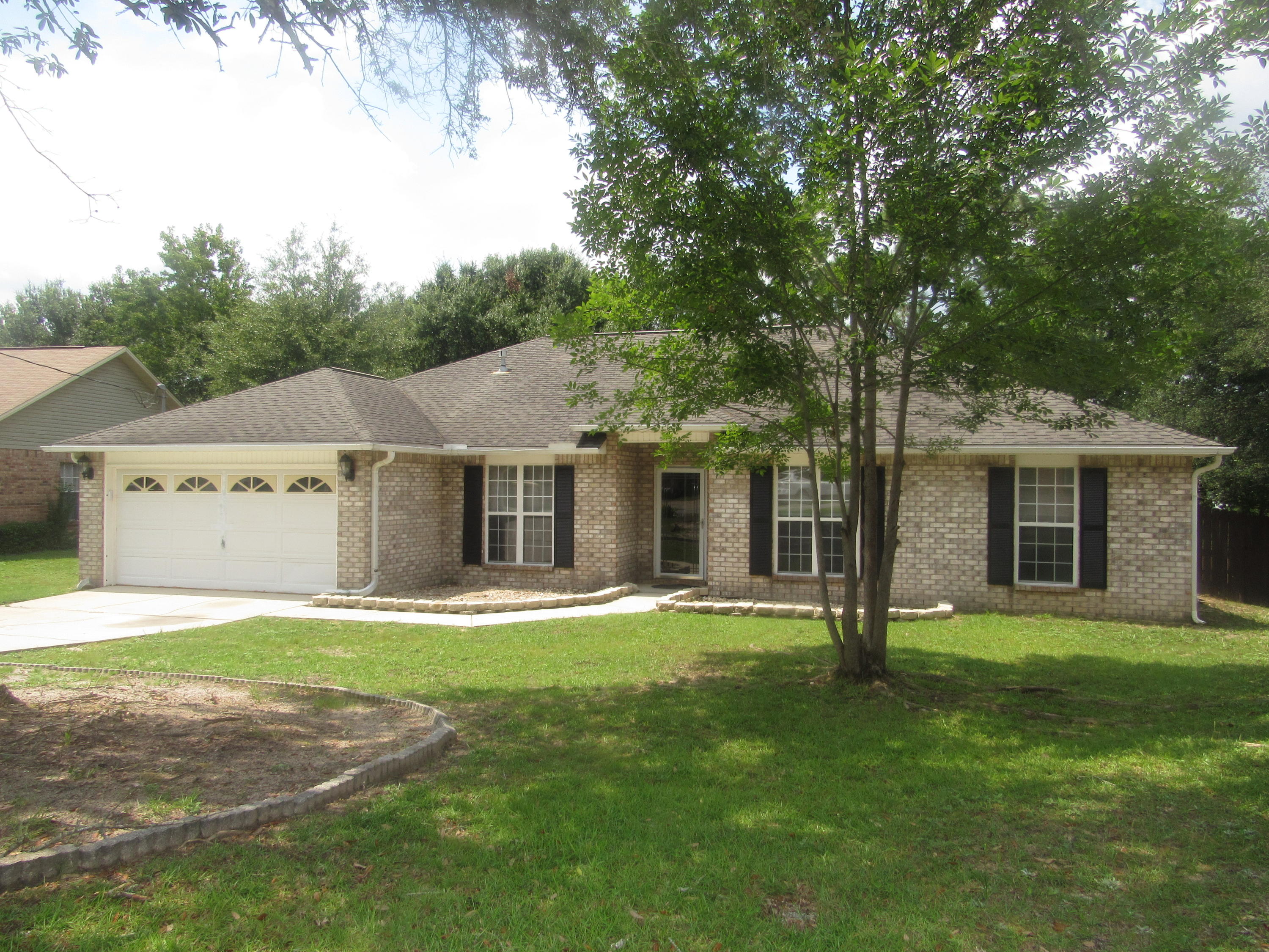 Great South Crestview Location. This all brick home has been updated with Populus Solid Surface countertops, new sinks, plumbing fixtures, tile flooring in both kitchen & bathrooms. There is also new carpet thru-out the home. The living room has vaulted ceiling, gas burning fireplace & ceiling fan. The kitchen has large pantry, large island & breakfast nook. There is also a formal dining room. All bedrooms are spacious & come with ceiling fans. The master bathroom has a tiled shower, soaking tub, double vanity & walk-in closet. Separate laundry room with closet. Levolor blinds thru-out, new high lavatories & alarm system. The 12'x19' screened back porch with ceiling fan. The 2-car garage with new opener, keyless entry & pulldown attic stairs for extra storage.