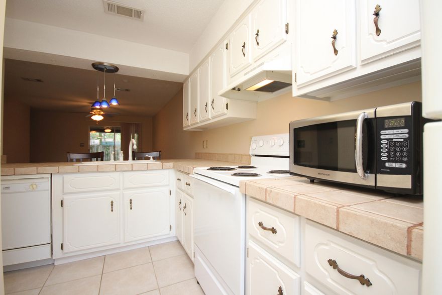 Welcome home. This beautiful town home has been immaculately taken care of. Brand new paint (professionally done!), two full bathrooms upstairs, spacious living area, upgraded kitchen countertops - this home is turn key! It truly has it all, including a washer/dryer, microwave, stove, refrigerator and they all convey, there's even bar stools at the breakfast bar, nothing is missing! Located right in the heart of Ft Walton Beach, it is just a few minutes drive to just about everything in the area. Don't snooze on this one!