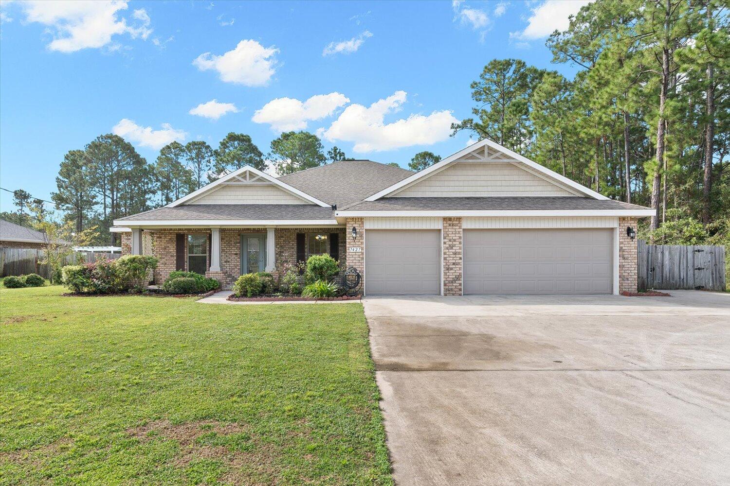 This beautiful home features an amazingly spacious design and includes lots of extras for a great price! High ceilings and a warm entry porch for enjoying your mornings and a cozy covered lanai porch out back for your evenings. The open kitchen features granite countertops, an island bar and stainless steel appliances. The master suite features two walk-in closets, garden tub & walk-in shower. The huge three car garage has a separate mini-split AC system to make it the perfect workshop or home gym. Park your boat/RV on the paved side driveway extension. You will enjoy the large, private fenced-in back yard with plenty of room for a future pool or backyard project. The roof solar panels will be paid off by seller, so buyers get super low power bills included at no extra cost!