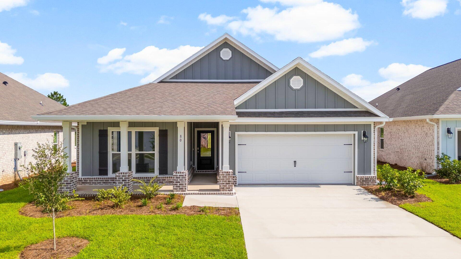 Welcome to the 80 Gray Owl Drive W, a new home at Owl's Head Farms in Freeport, Florida. This home has a large covered front porch. The front entry hallway leads to a light-filled open-concept living area with 9' ceilings. The kitchen impresses with quartz countertops, undermount single basin sink and a dedicated water filter faucet. stainless steel appliances, and a large center island with bar seating overlooks the great room. Brushed nickel fixtures are throughout the home and include a lifetime warranty. Adjacent to the kitchen is the dining area perfectly positioned for meals and gatherings, while the living room's wide layout invites relaxation and socializing. The primary bedroom, set at the back of the home, offers a serene escape with a luxurious bathroom featuring a double vanity, a walk-in shower, and two generously sized walk-in closets. Three additional bedrooms and a full bathroom are located in a separate wing, ensuring privacy for family or guests. The interior features EVP flooring throughout the living area and carpet in each bedroom.
Rounding out the home is an oversized covered patio, ideal for enjoying Florida's sunny days, and a convenient laundry room. This home has Smart technology including 5 Deako smart switches, Kwikset keyless entry and a programmable thermostat that can be controlled though an app on your phone. The Delray's combination of space, style, and practicality makes it a perfect fit for any family.