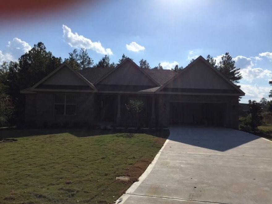 Come buy our BEAUFORT in our HAMMOCK BAY community located in Freeport FL. This BEAUFORT offers 2745 SF of living space with 4 large Bedrooms and 3 full Baths plus a Living Room/Office. As you enter the BEAUFORT from the covered front porch the wide foyer opens to a large Dining Room and Living Room/Office. Continue to the 20'x17 Family Room with an entire wall of windows, coffer ceiling and open Kitchen. The Family Room also has a gas fireplace. The Kitchen has granite countertops, an island and 42 cabinets. Just off the Kitchen is a screened in porch that's perfect for relaxing or entertaining family and friends. The Master Suite includes a large walk-in closet, double vanities, tiled shower and garden tub.