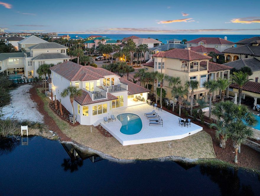 Modern elegance meets artful coastal contemporary design in this awe-inspiring beachside lake front residence ideally located two tiers off the Gulf of Mexico in the gated community of Destiny. In early 2018, this home was another remodel completed by Coastline Luxury Home whom finely appointed the home with professional interior design & furnishings. This home is masterfully configured featuring 5 bedrooms (including a 6th bunk room), 4 full bathrooms and a large open floor plan with clean lines and pristine lake vistas. This rental machine presents exemplary investment opportunity with over $200,000 in projected gross annual rental income for 2019.