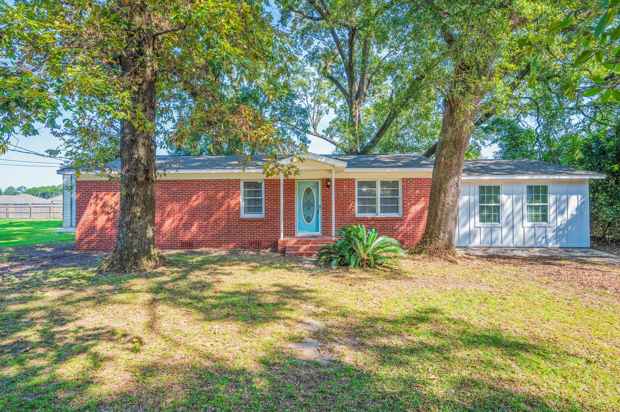 Welcome to this beautifully updated 4-bedroom, 2-bathroom home in the heart of Pensacola. Original hardwood flooring carries throughout the main living spaces, offering warmth and timeless character. The home features a newly remodeled kitchen complete with stainless steel appliances, custom cabinetry, and a farmhouse sink, making it both functional and stylish. Both bathrooms have been thoughtfully updated, and a newly added fourth bedroom provides a spacious private bath, creating the perfect retreat for guests or a luxurious owner's suite. A bright and inviting Florida room overlooks the large backyard, an ideal setting for entertaining, gardening, or simply relaxing and enjoying the Florida lifestyle. This home blends classic charm with modern updates and is move-in ready for its next owner.
