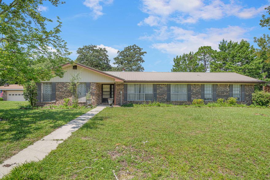 Have you heard the saying ''good bones''? Well this all brick home has lots of potential. Original owners have enjoyed this home for many years. It does need some updating but it has a great floor plan, good location, large corner lot and metal roof. Open floor plan with kitchen and family room. Family room has a wood burning fireplace. Separate living room & dining room. Great extra spaces that could be used as flex room for playroom, office, gaming are etc. Enclosed 26x12 Florida Room for watching nature in the backyard. Patio for outdoor grilling. Sprinkler system, large corner lot. Bedrooms have good sized closets. Master bath has double vanity. Garage is extra large with double sink by washer/dryer area. Come see it today!