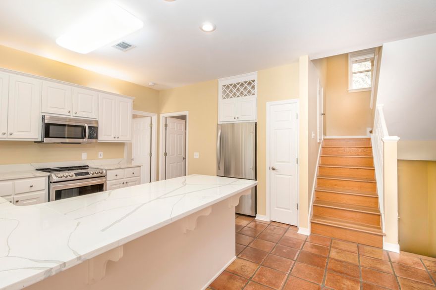 Tree house at the beach ! Mature oaks shade, give storm protection and add privacy to this home on the southside of Big Redfish Lake. Walk to the beach or get there by boat/ SUP. One of the highest points on the Gulf of Mexico. Outside  storage building. Excellent neighborhood and no HOA. Oak and Saltillo tile for Floors with new quartz countertops and LG stainless steel appliance package in the kitchen. New dock . Wood burning fireplace with cypress mantle lends warmth to the great room.