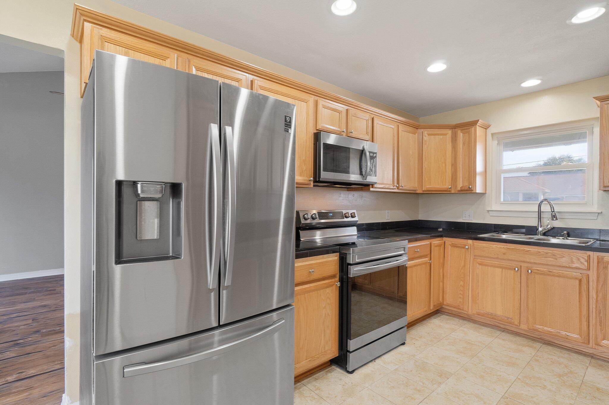 Such a great location if you desire East Navarre for a quicker commute to Hurlburt Field AFB! This charming light blue home is great for the first time buyer. The new solar panels will be paid off by the seller at closing, so this is no extra cost to you! The home features a fully fenced yard, NO hoa, a double car garage, new stainless steel appliances and a corner fire place in the family room. The back doors exit to an amazing deck space for entertaining and grilling out. Very affordable for todays market. MOVE IN READY for a flexible closing for your needs!!! come visit this adorable home today!