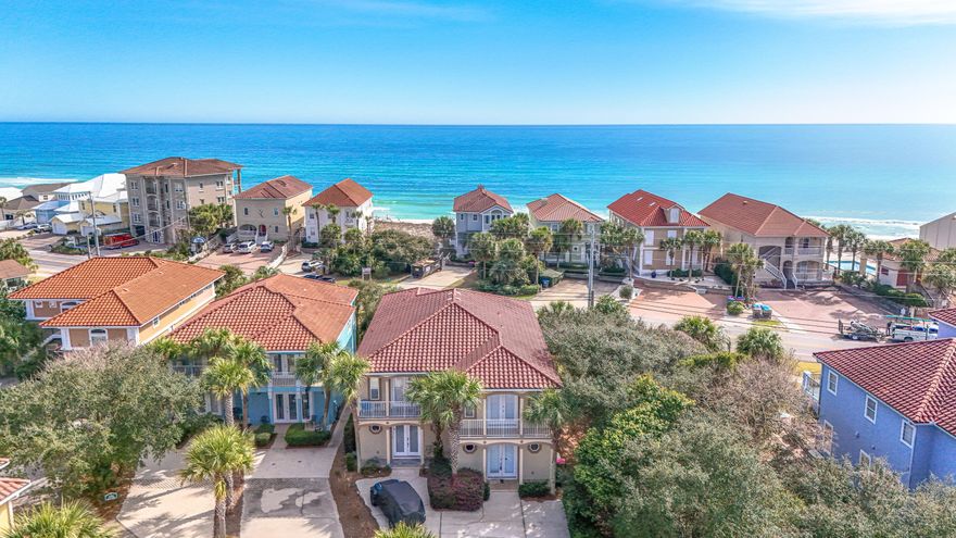 Welcome to this beautiful coastal home located on the desirable west end of Panama City Beach, close to 30A/Rosemary Beach, in the gated community of La Valencia. Designed with a private beach resort feel the home is perfectly positioned directly across the street from the beach. This spacious 3 or 4 bedroom, 3.5 bathroom home offers gulf views, great indoor and outdoor living spaces, and a layout designed for relaxing and entertaining. The main living area features an open kitchen, dining, and living room layout that is bright and inviting. The kitchen is fully stocked and has custom cabinetry, generous counter space for meal prep or entertaining, and bar seating for four adjacent to dining seating for six. Just off the living room, you'll find a large covered balcony with gulf views, creating the perfect spot for morning coffee, evening sunset/cocktails, or enjoying that beachy breeze and the sounds of the surf! The primary suite is spacious and filled with natural light, with a private balcony so you can step outside and take in the views anytime. The ensuite bathroom features a dual vanity, soaking tub, and separate shower, creating a comfortable retreat. Downstairs, the home offers a separate living area complete with a sitting area, dining/game table, and wet bar with sink, mini fridge, dishwasher, ice maker, and microwave. This flexible space is perfect for entertaining after a beach day, serving as a fourth bedroom with sleeper sofa and private kitchenette, or creating a fun bunk/hangout area for kids. There is also patio access, making it easy to enjoy the outdoor space. The home features tile flooring in the main traffic areas downstairs and hardwood flooring in the main upstairs living areas, adding convenience for cleaning and durability! Located in the gated La Valencia community, residents enjoy wonderful amenities including a heated owners pool, hot tub, clubhouse, fitness center, second gulf front pool, private gated beach access, and a tennis/pickleball court. The clubhouse is complete with kitchen, restrooms, and gaming set up perfect for hosting game/poker night. The second pool is gulf front and has beautiful views of the Emerald Coast as well as restrooms and golf cart parking for added convenience. The location truly cannot be beat! You are conveniently located near Pier Park, the scenic 30A corridor, shopping, dining, and entertainment. Everyday conveniences are also close by with Aldi, Publix, and Walmart just minutes away. With short term rentals allowed, gulf views, beach access directly across the street, and fantastic community amenities, this property offers a great opportunity for a primary residence, second home, or vacation rental investment in a wonderful area of Panama City Beach! Come see!