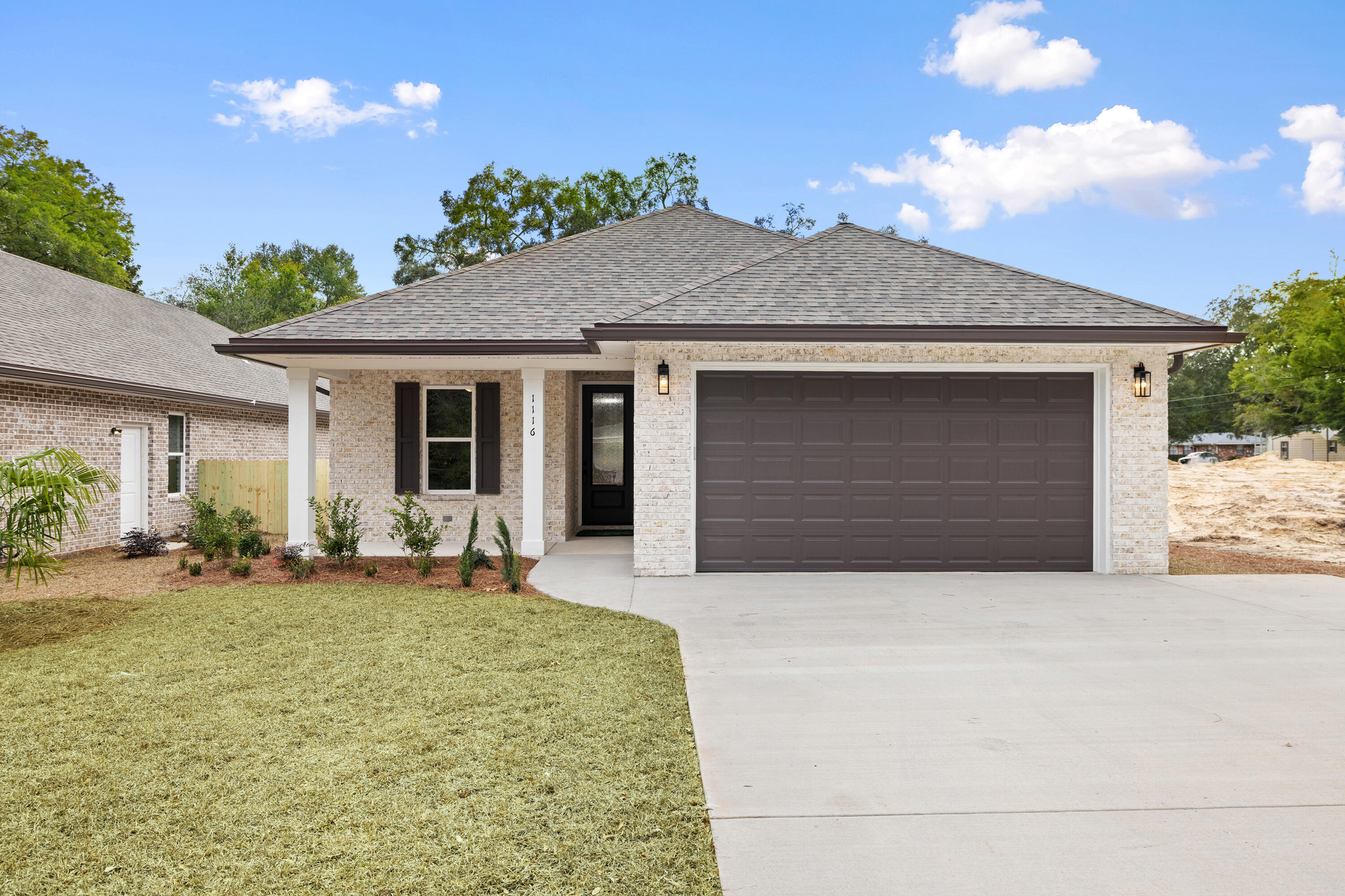 This Beautiful 4 bedroom, 3 bath home is located in the heart of Niceville, but without an HOA.  This home has many custom features. If you like entertaining, you'll love this OPEN FLOOR PLAN, featuring 9 ft. ceilings throughout with a trey ceiling in the family room and the master bedroom, an oversized garage 22.4 x 19.8, extra parking pad, and upgraded spray foam insulation in the roof.  The kitchen is upgraded with white custom cabinets, soft close drawers, upgraded sink, gas stove, crown molding, walk in pantry, & quartz countertops.  Enjoy upgraded lighting, floor plug in the family room, crown molding in the main areas and master bedroom.  The master bathroom is loaded, boasting a custom tile shower with rainhead, 2nd sprayer, bench, seamless glass door and custom mirrors The covered back porch is a great area to relax and have a glass of wine or cup of coffee to start your morning. The large Level back yard with a privacy fence, sprinkler system and landscaping, make maintenance a breeze, and is perfect for the children and family pets to play. Utilities with power will be underground. The builder pays 7,500.00 towards buyers closing cost, and doc stamps on the deed and his portion of prorated taxes.  Call today for a viewing.  This home will not last long!!