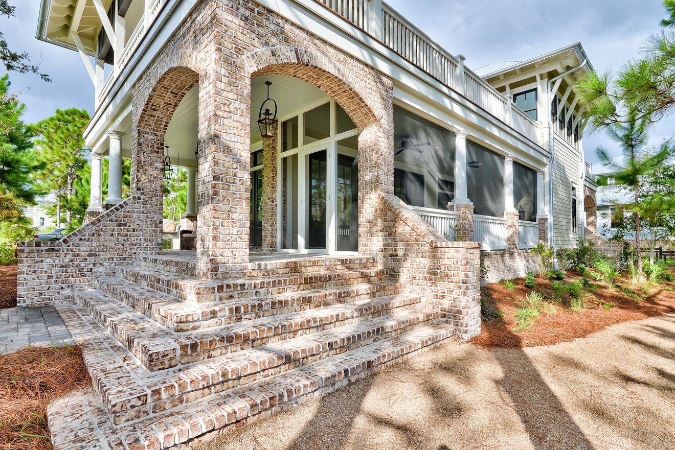 Perfectly situated in charming Forest Lakes, this home is on a lake and adjacent to the neighborhood green. Designed to take full advantage of the location, the living areas & bedrooms have water views. Eurowall doors open the living/dining area to a large screened porch you will adore! Imagine watching the sunrise and moonrise from the porch off of your master bedroom. Privacy abounds in this home, yet you're steps away from amenities. Built by Luke & Blue's, the upgrades include 5'' solid oak flooring, poplar ship lap walls, marble counters, fireplace, 10' ceilings, Thermador & Viking appliances, brick porches and top of the line trex decking. See the documents section for a full list. Walk or bike to the beach, restaurants and shopping. Great full time living!