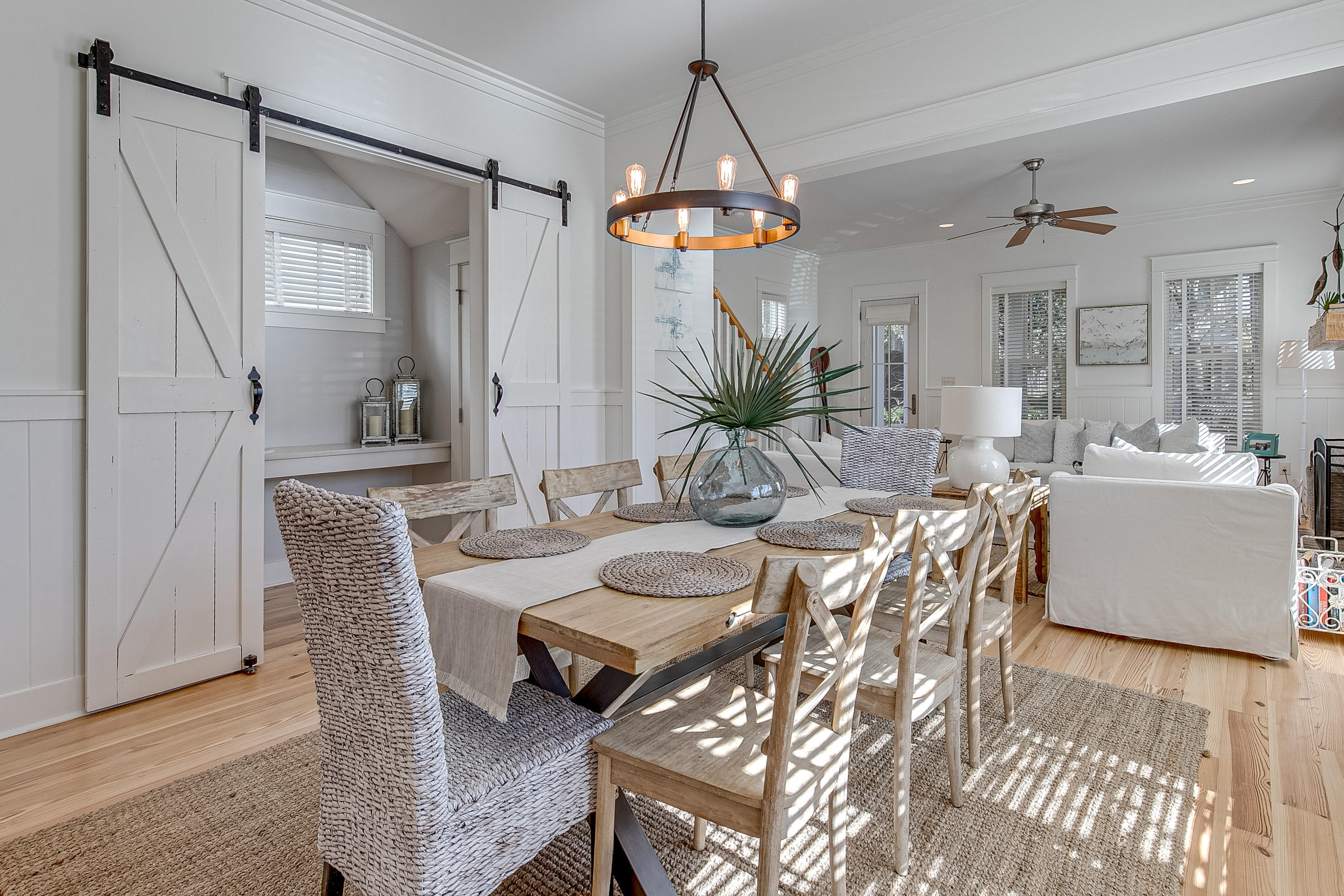 Nestled by Dragonfly Park on a corner lot in Watercolor's Crossings District this beautifully updated beach home awaits new owners! Coastal furnishings thoughout compliment beach style living.A charming brick wood-burning fireplace is the focal point in the living area which steps out onto a cozy screened porch. The recently updated kitchen is well appointed with s/s appliances white quartz countertops and a large pantry. The spacious master bedroom is on the main level while upstairs features 3 bedrooms and an extra living space making this the perfect family home. The location is just steps away from the Dragonfly Pool and walking distance to the shops and restaurants at The Crossings.