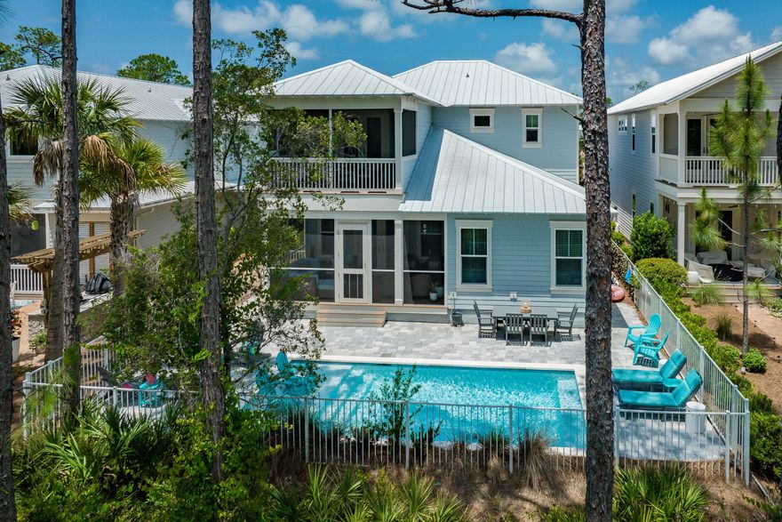 RECENT PRICE REDUCTION- THE ONLY HOME WITH POOL AVAILABLE IN NATUREWALK. Welcome to 70 Prairie Pass, your dream coastal retreat in the heart of the popular NatureWalk at Seagrove community. Perfectly positioned just a short golf cart ride away from the iconic 30A and the shimmering waters of the Emerald Coast, this home is a rare find in a highly sought-after neighborhood. This stunning residence, set in the tranquil Phase 3 of NatureWalk and backing up to the serene State Forest, offers unmatched privacy and a quiet setting. The Sandcastle floor plan is a favorite, featuring four spacious bedrooms, each with its own en suite bathroom, providing comfort and convenience for everyone. The primary suite on the main floor boasts a luxurious soaking tub and a separate shower with views of the private pool, while the upstairs primary suite includes double sinks and opens onto a covered porch. Additional family accommodations include a second-floor bedroom with two king beds and its own porch, perfect for guests, and a cozy bunk room designed for the little ones. Also upstairs you'll find an additional primary suite. 

The home's interior is designed with a modern beachy aesthetic, featuring crisp, clean quartz countertops and sleek white cabinetry throughout. The outdoor living spaces are equally impressive, including a private pool - a rare amenity in this community. Offered fully furnished, this home is ready to welcome you from day one. 

NatureWalk at Seagrove offers an array of resort-style amenities for an active and vibrant lifestyle. At The Gathering Place, you'll find two pools, a kiddie pool, grills, a fire pit, and a jacuzzi. The community also includes a pickleball court, a kids' play area, swings, fitness stations, and miles of picturesque trails, including a direct path to the beach, which is just a five-minute bike ride away.

Homes with pools in NatureWalk are in high demand and sell quickly, making this an exceptional opportunity to own a piece of paradise where you can create lasting memories. For more information or to schedule a private tour, contact us today. Welcome to 70 Prairie Pass, where every day feels like a vacation.
