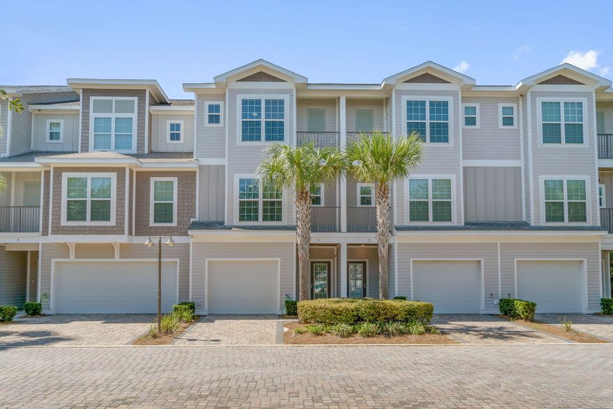 ATTENTION INVESTORS! Looking for a great rental property opportunity? Discover the pinnacle of upscale coastal living in this exclusive 20-unit, townhome-style complex located in the heart of Miramar Beach. This low-density community offers unparalleled privacy and serenity while being just a short 3-minute walk from pristine beaches and the iconic Pompano Joe's Seafood House. Fully furnished and impeccably maintained, each residence embodies ''as-new'' quality and sophisticated design.Step inside to experience the thoughtfully crafted interiors. The first floor features elegant porcelain tile flooring throughout, a cozy bedroom with custom-built bunk beds, and a full bathroom. The inviting backyard patio, adorned with stylish pavers, creates a perfect space for entertaining or unwinding. The insulated one-car garage, complete with a dehumidifier and tiled flooring, offers versatility and can easily transform into an additional bedroom if desired.

Ascending to the second and third floors, you'll find stunning natural oak hardwood floors complemented by soaring 9-foot ceilings, 5-1/4" crown molding, and energy-efficient LED lighting. The gourmet kitchen is a chef's dream, equipped with premium stainless-steel appliances, including the 2022 Frigidaire Gallery series refrigerator and microwave, as well as a flat cooktop range and dishwasher. Ample storage is provided by soft-close Arista Craft cabinetry and a spacious pantry. The open-plan dining area, featuring a communal wood dining table, is perfect for hosting memorable gatherings, while the outdoor balcony offers a serene spot for enjoying snacks and refreshments.

On the second floor, an additional bedroom boasts views of the community's inviting pool, complete with lush Driftwood-inspired features. The third-floor master suite is a luxurious retreat, showcasing a generous walk-in closet, an expansive shower, and a modern garden soaking tub that exudes spa-like elegance.

Built to endure, the exterior of these townhomes is constructed with durable fiber cement board siding, finished with resilient PPG elastomeric paint, and fitted with impact-resistant glass windows capable of withstanding winds up to 150 MPH.

This rare offering combines refined design, premium amenities, and an unbeatable location. Schedule your viewing today and immerse yourself in the luxury and tranquility of this exceptional community. 