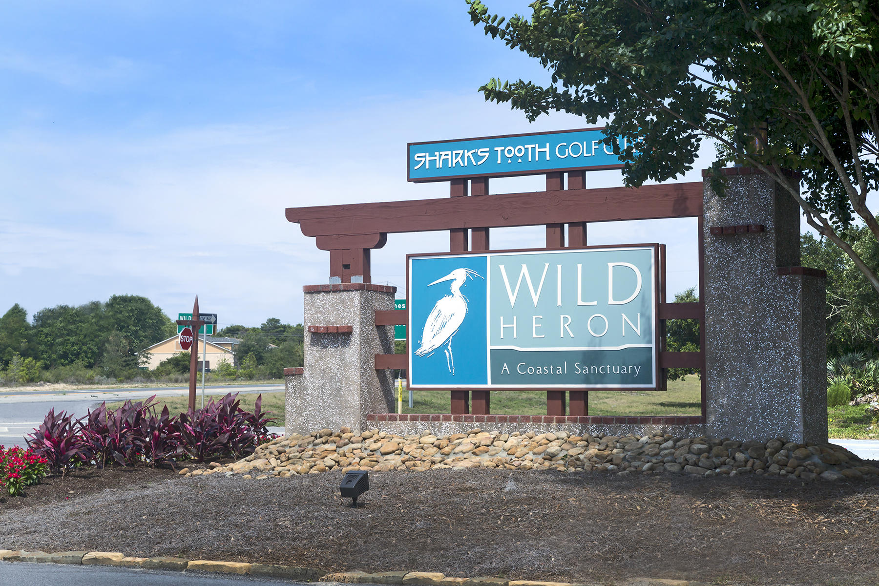 Discover Wild Heron's luxury living in a recreational community. This is a breathtaking lakefront gated community.This unique lot sits on the 10 th hole on this award winning course, SHARK'S TOOTH is designed by GREG NORMAN. Wild Heron is an upscale development with custom built homes in a Craftsman style design.This property sits at the end of Lost Cove Lane and has preserve land on the north side and across the property sight line onto the 10 th green. The lot allows you to build your dream house with privacy and top notch luxurious amenities.Prospect Point Club house includes lake front amenities boat dock, canoes, kayaks. The 25,000 sq ft Club house invites you to enjoy the heated pool, hot tub, fitness center, bar, grill playground, campfire ring ,tennis courts.