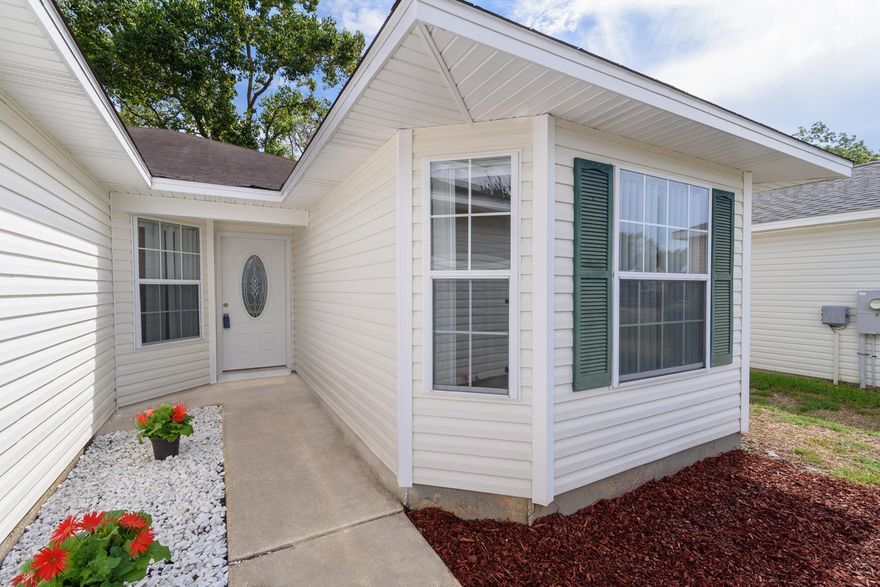 New Roof and New HVAC.Beautifully maintained 3 Bedroom, 2 Bath house with a wonderful open floor plan. Walking into the cathedral ceiling living room accompanied with a tile edged gas fireplace, you will be amazed by the space and light. Open to the living area, the kitchen boasts lovely granite countertops, stainless steel appliances and ample cherry wood cabinetry. The dining area adjoins with oversized upgraded tile and sliding glass door to the backyard space; that is completely privacy fenced in with a nice wood deck perfect for entertaining.The large master bedroom is tucked away with its private bathroom. Two nice additional bedrooms share their own hall entrance with the second bathroom.