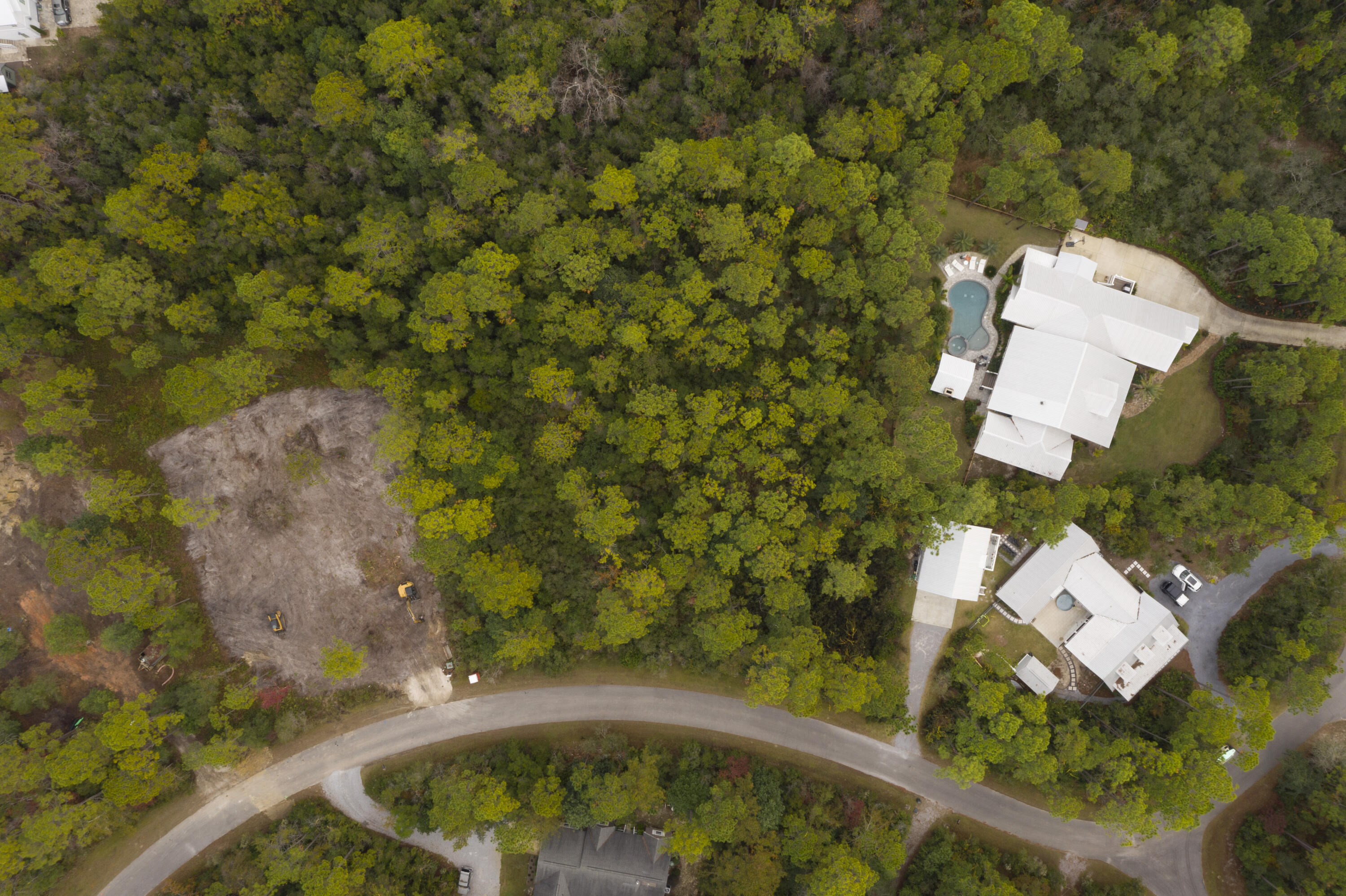 Prime 3/4 acre lot in desirable ''The Woods'' subdivision in East Point Washington. Upscale homes in great location only a few miles from Grayton, Watercolor, Seaside and Seagrove. New Dune Lakes Elementary and Emerald Coast Middle within miles. Looking for Quiet location with full time residents, this is the subdivision you are looking for. Bay access with neighborhood dock. Drone photos of lot, neighborhood and location to Bay coming soon.