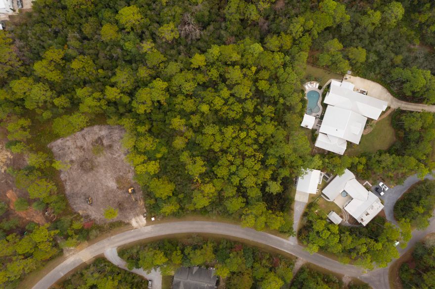 Prime 3/4 acre lot in desirable ''The Woods'' subdivision in East Point Washington.  Upscale homes in great location only a few miles from Grayton, Watercolor, Seaside and Seagrove. New Dune Lakes Elementary and Emerald Coast Middle within miles. Looking for Quiet location with full time residents, this is the subdivision you are looking for. Bay access with neighborhood dock. Drone photos of lot, neighborhood and location to Bay coming soon.