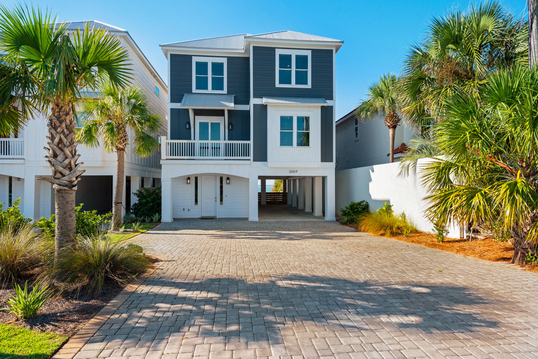 ''Sun Daze'' is a beachfront dream home. Located in the beautiful Panama City Beach, yet close enough to enjoy the attractions of the famous 30A. Featuring a private pool, seven spacious bedrooms, unique decor, and an ocean view, this home is truly a gem. It sits next to ''Tan Lines'' and ''30A Away.'' Step inside where you will find on the 1st floor a sitting room with a large, flat screen TV, an additional refrigerator, a half bath, and a kitchenette. Head out the back door to relax around the pool area. The spacious back deck has plenty of space for sun bathing, grilling on the charcoal grill, or watching the waves.