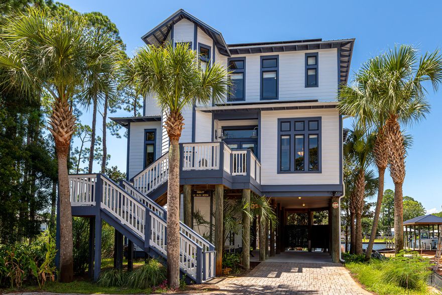This exceptional property offers a plethora of inviting outdoor spaces, making it the epitome of waterfront living. Step onto the large, covered deck on the second floor, and you'll find an ideal spot for entertaining, relaxing, and enjoying the stunning views of Buck Bayou. With its open floor plan, the second floor features a well-equipped kitchen, laundry room, full bathroom, and a picturesque office, all designed to cater to modern living needs, offering both functionality and water views. The kitchen boasts a large island that provides ample workspace and additional seating for casual dining or socializing, stainless appliances, double oven, warming drawer, gas range with grill and wok features, pantry, wet bar, complete with an ice maker and more! On the third floor are the primary