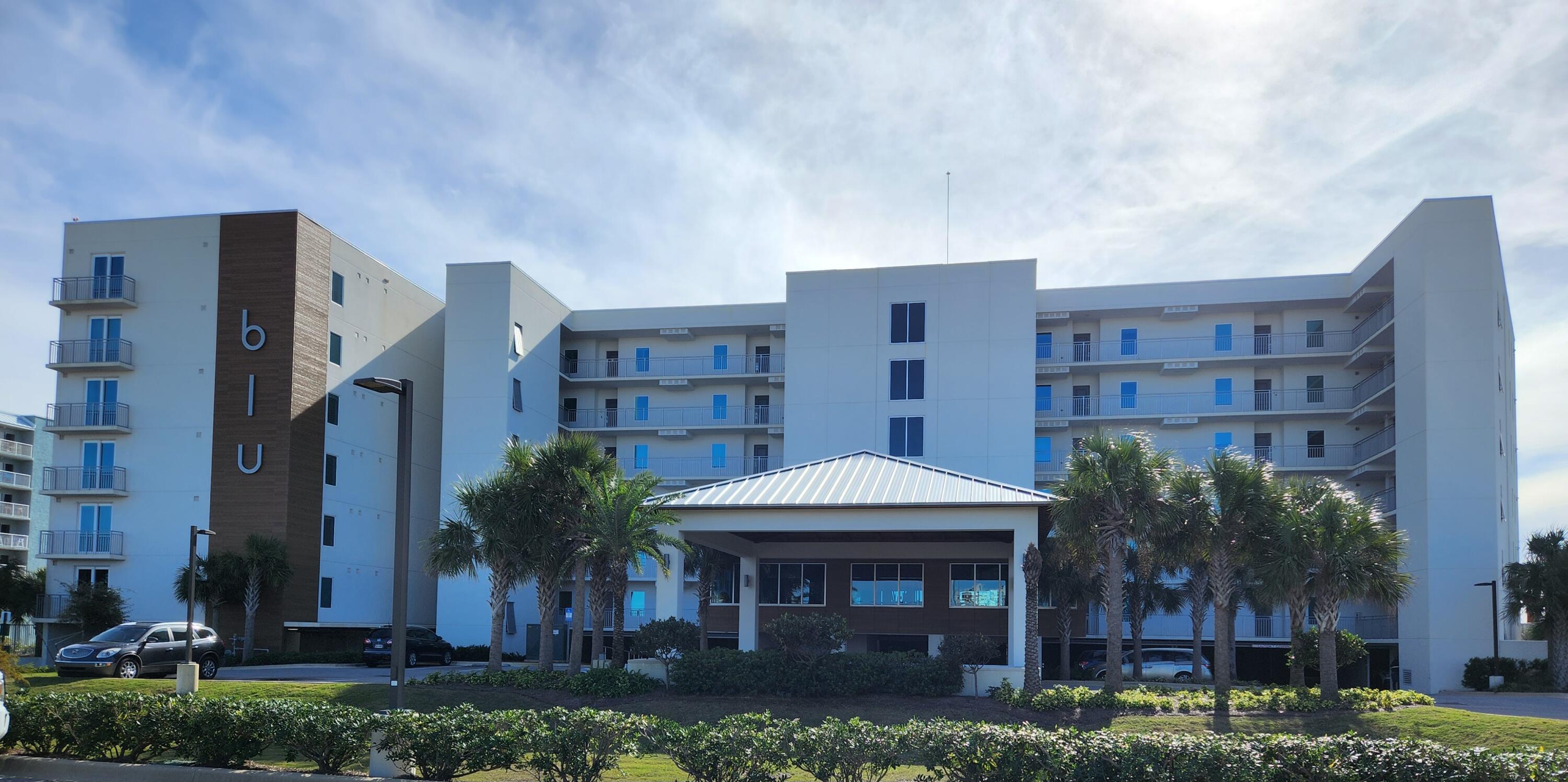 The BLU is the quintessential gated waterfront condo that is known for coastal opulence contemporary living on the beautiful beach of Okaloosa Island. This fully furnished 4th floor, three-bedroom + media room, three-bathroom unit boasts 1,837 square feet of luxurious living space featuring endless views of the Gulf . With exquisite features and modern amenities, it's a perfect blend of style and comfort for a primary, secondary residence, or investment property. Upon entering you will immediately notice the exquisite fixtures and finishes, from the porcelain tile flooring throughout, open floor concept, 29' balcony, to the frameless shower doors in each bathroom. The kitchen features quartz countertops, designer cabinetry, recessed lighting, large island w/ barstools, stainless steel