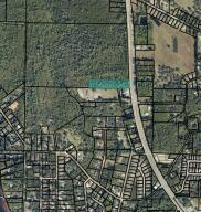 3.03 Acres Commercial Land in a area that is seeing a lot of new development, located on Hwy 87 in Holly/Navarre , great investment property or development property, heavy traffic count going to Navarre Beach , excellent location for many uses. the seller believes property can be rezoned commercial after his conversation with the county.