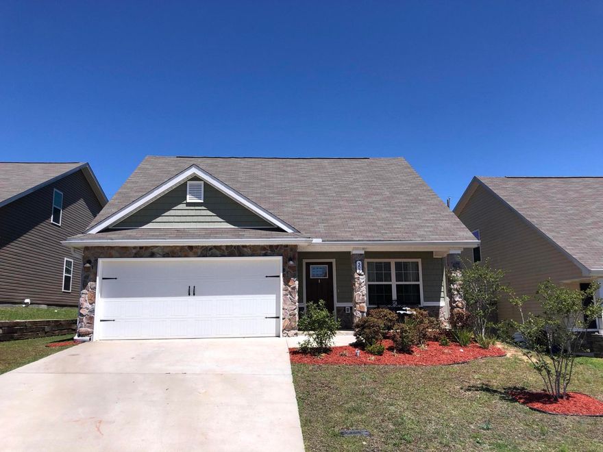 WOW! 3 year old beautiful well kept FIVE bedroom home in newer community of Stillwell Estates. Inviting covered front porch w/stone accents & columns give plenty of curb appeal. Step inside to cozy living area w/open feel to kitchen. Kitchen has Stainless appliances, high bar top overlooking living room, breakfast area & pantry. 1st floor Master BR is nestled for a private retreat feel. Master bath has walk-in closet, dual cooper sinks, garden tub & sep. shower. 1st floor has Half bath & laundry. Step outside from kitchen to covered lanai & nicely landscaped fenced backyard. 2nd floor has 4 additional bedrooms w/ample closet space and ceiling fans. Fresh paint throughout. HOA cuts the lawn. Sidewalks. Near base. Home Warranty included. Transferable Termite bond. CALL TO SEE! GREAT HOME!