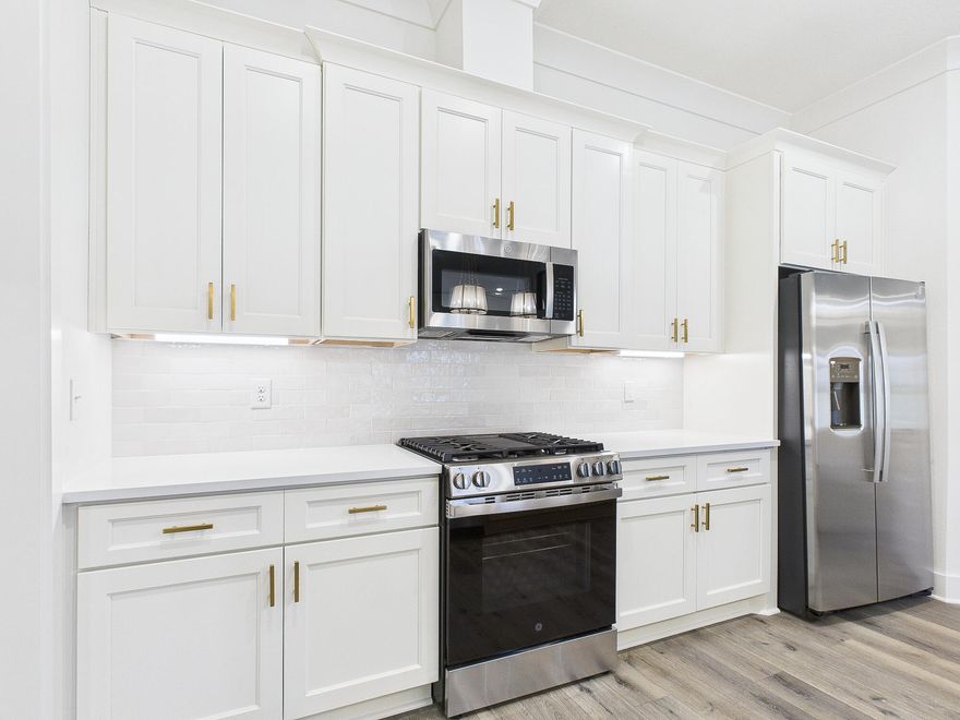 ***BUILDER SUPERBOWL LX INCENTIVE!!!***   This stunning brand-new Craftsman-style residence in the heart of Niceville offers a rare combination of modern luxury and turn-key convenience. Boasting five spacious bedrooms and three full bathrooms across a thoughtfully designed 2,656-square-foot layout, this home is engineered for both sophisticated entertaining and comfortable daily living. The heart of the home is a chef-inspired kitchen featuring premium quartz countertops, a professional gas range, custom soft-close cabinetry, and a deep farmhouse sink, all centered around a functional island and a massive walk-in pantry. High-end luxury vinyl plank flooring flows seamlessly through the main living areas, accented by elegant crown molding and soaring vaulted and tray ceilings that enhance the home's open, airy feel. The split-bedroom floor plan ensures maximum privacy for the primary suite, which serves as a true retreat with its spa-like garden tub and dual-vanity bath. Efficiency and safety are paramount, with the inclusion of a tankless gas water heater, natural gas heating, hurricane-rated shutters, and a full sprinkler system. Unlike most new construction, this home is truly move-in ready, featuring a fully installed privacy fence, custom window blinds, and a stainless steel refrigerator already in place. Outside, the oversized three-car garage provides ample space for vehicles, a boat, or a workshop, while the level backyard offers a secure oasis for relaxation. Situated in the top-rated Plew, Ruckel, and Niceville High school districts, this 2025-built home is just minutes from Eglin AFB and the white-sand beaches of the Emerald Coast.