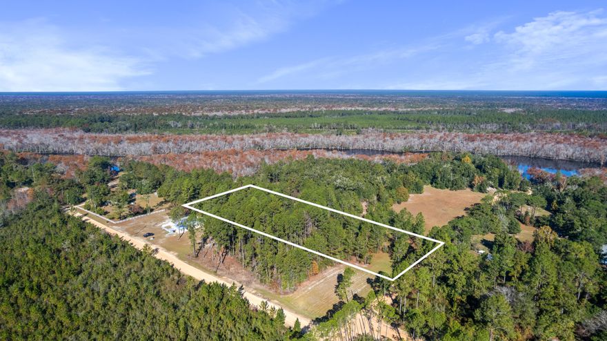 Almost half way between Freeport and Panama City Beach-If you have been searching for your perfect lot for your forever or second home- you need to look no further. This serene 2.75-acre lot nestled in the quiet community of Ebro, Bay County offers a blend of privacy and convenience, directly bordering Washington county w egress to the East River- This property offers a peaceful retreat while being a short drive from Panama City Beach and the Northwest Beaches International Airport. It is an ideal setting for those seeking tranquility without sacrificing proximity to modern conveniences.