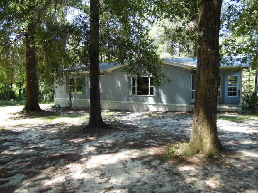 With a little love, this REO could be the perfect home or investment property! The home features a cosy wood burning fireplace in the living room, the kitchen has simulated cherry wood cabinets and there is a garden tub in the master bath. Home sits on .64 acre with beautiful trees for shady serene yard. Plenty of space to have your dream home!This is a Fannie Mae Homepath Property.