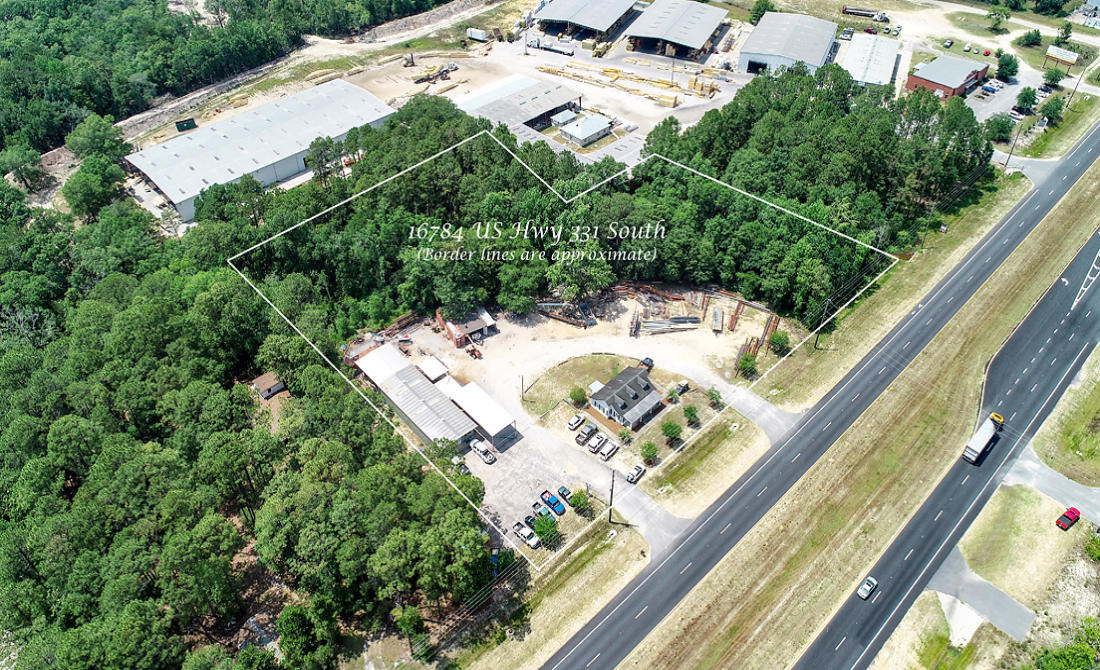 COMMERCIAL/LIGHT INDUSTRIAL OPPORTUNITY on Growing HWY 331 SOUTH! 3.7 +/- Acres with 414' of Highway Frontage on 331. Property is located within Freeport City Limits. Two buildings currently on site with Tenant in place. Attractive, cabin-styled Office building has 4 offices, 1 kitchen area, 1 loft & 1 bathroom Office building is approximately 1,100 square feet Metal building/shop is insulated plus heated & cooled. It has 1 main office, 1 Break-room/Office & 1 bathroom. Three roll-up doors at ground level (2 8' doors & one 10' door). Covered areas for outside work or storage. City water & septic tank. Located on west side of Hwy 331 & just over a quarter-mile south of the Publix Shopping Center. Improved Property with many possibilities for uses. Seller ready to Sell!