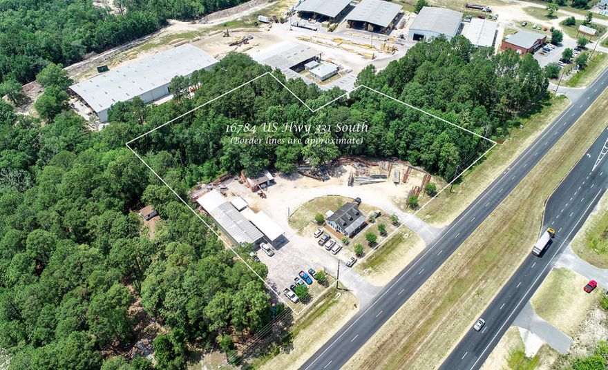 COMMERCIAL/LIGHT INDUSTRIAL OPPORTUNITY on Growing HWY 331 SOUTH! 3.7 +/- Acres with 414' of Highway Frontage on 331. Property is located within Freeport City Limits. Two buildings currently on site with Tenant in place. Attractive, cabin-styled Office building has 4 offices, 1 kitchen area, 1 loft & 1 bathroom Office building is approximately 1,100 square feet Metal building/shop is insulated plus heated & cooled. It has 1 main office, 1 Break-room/Office & 1 bathroom. Three roll-up doors at ground level (2 8' doors & one 10' door). Covered areas for outside work or storage. City water & septic tank. Located on west side of Hwy 331 & just over a quarter-mile south of the Publix Shopping Center. Improved Property with many possibilities for uses. Seller ready to Sell!
