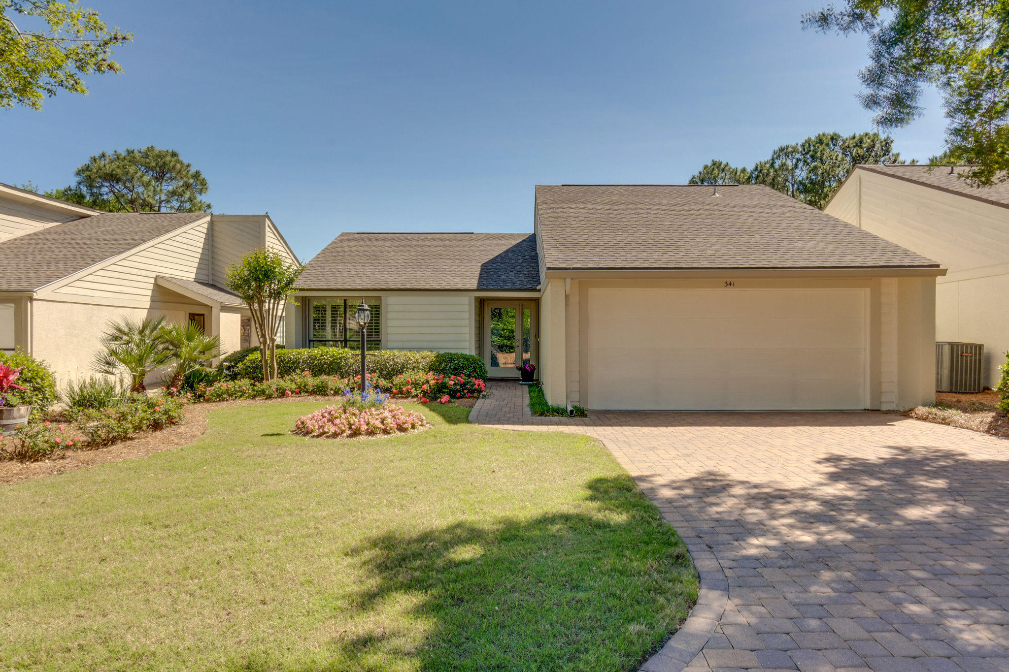 Under contract with a 72 hour kick out clause. Perfect Resort Patio Home with garage awaits! Attention has been paid to every detail in this completely renovated single level home. From the yard you are welcomed with well maintained landscape and flowers galore. As soon as you enter this home with soaring beamed ceiling, open floor plan and a view to a picture perfect fenced backyard with large patio, you realize this could be the home for you! The updates are numerous flooring, cabinetry, bathrooms, plumbing, hardiplank and roof (2015), AC & water heater (2018), hurricane shutters, pavers and more! The home is located within a gated resort community with much to offer just a golf cart or tram ride away. Neighborhood seasonally heated pool nearby.