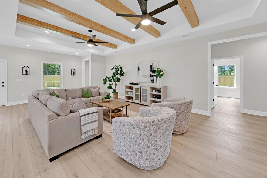 Welcome to Summerfell at Old Town, Destin's newest development! This stunning property boasts 2620 square feet of luxurious living space, with 5 spacious bedrooms and 3 beautifully appointed bathrooms. As you step inside, you'll be greeted by an open floor plan that seamlessly flows from room to room. The living room features stunning beamed ceilings and beautiful runmill isle flooring throughout, creating an elegant and sophisticated ambiance. The kitchen is a chef's dream, complete with a stylish kitchen island with pendants, sleek quartz countertops, and stainless steel appliances. You'll love cooking and entertaining in this space, which is perfect for hosting family and friends. The bedrooms are spacious and well-appointed, with large closets providing plenty of storage space.