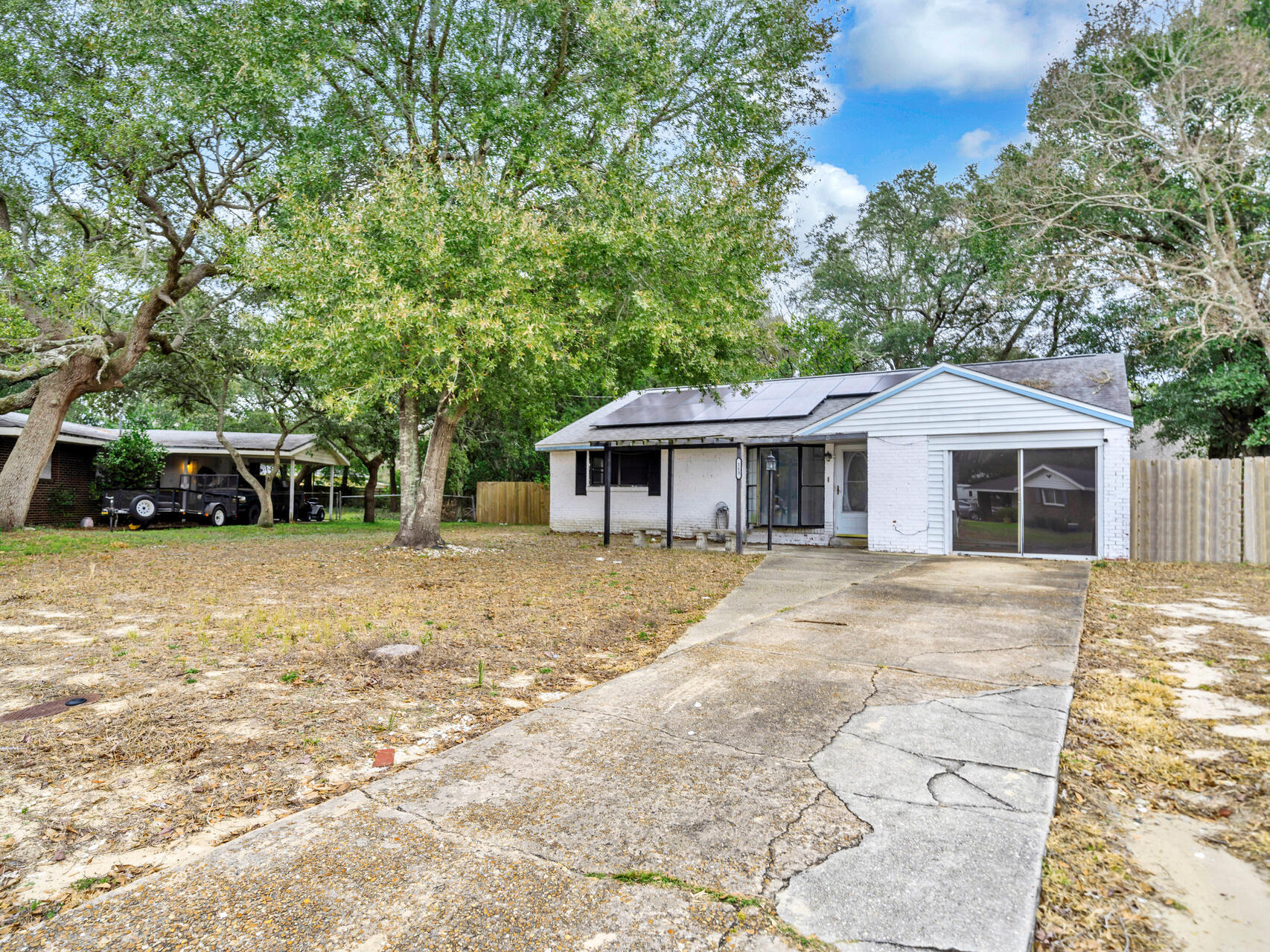 Just minutes from the military bases, the beaches, shopping, schools and more - This brick home is ready for your family! Fantastic opportunity to own a beautifully updated 4-bedroom, 2-bathroom home in the heart of Fort Walton Beach! This spacious 1,700+ sq. ft. residence sits on a large, private lot over a quarter acre. Enjoy two living areas, a separate dining space, and plenty of room for entertaining. Endless countertops, SS appliances, LVP, Tile and brick flooring through-out (NO CARPET), in-door laundry area, and more!  Plus, gain the benefit from new solar panels that will be fully paid off at closing! The large backyard offers a shed, an enclosed porch, and room for a pool or outdoor oasis.