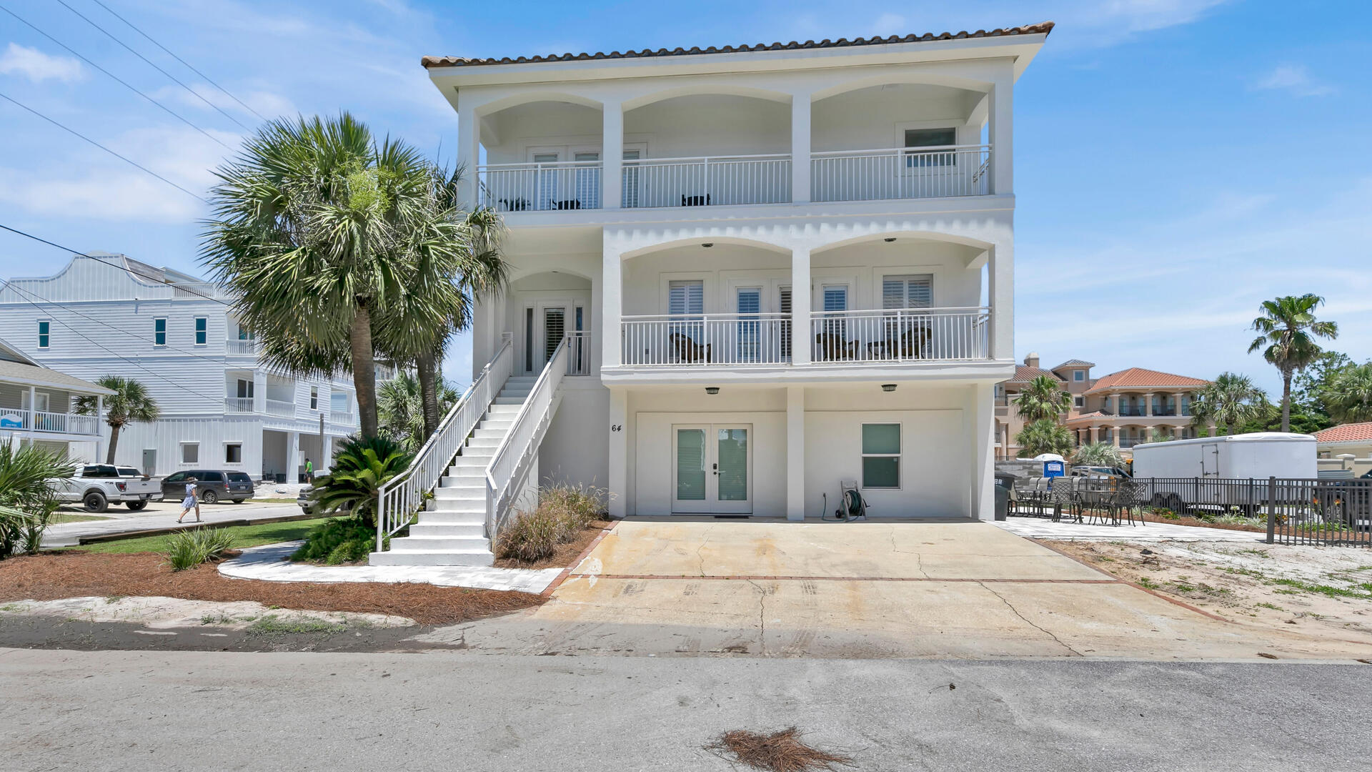 LOCATION, LOCATION, LOCATION! + NO HOA! Welcome to 'Ohana'. This beautiful, recently renovated vacation home located less than 100 yards from the beach access and situated on a corner lot must be seen to be appreciated! The exterior of the home has been recently painted and a new paver patio and landscaping has been added. There is even room to add a pool!As you enter the home, the finished ground floor features a media lounge complete with full sized refrigerator and sleeping arrangements for up to 6 people. There is also a king suite and queen suite each with their own private bathrooms.