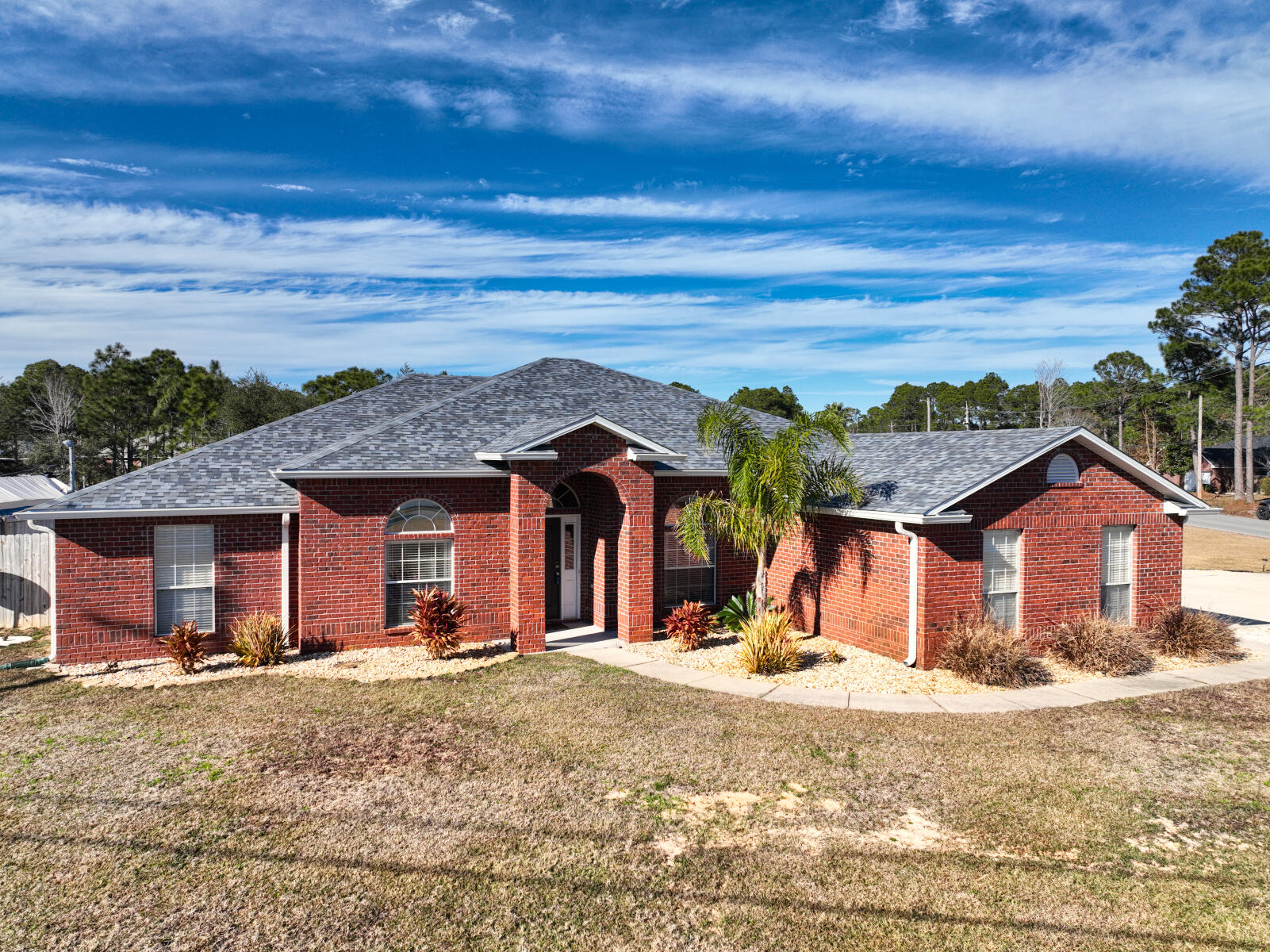 Back on the Market at no fault to seller!!! Beautiful brick home on a large corner lot located in Holley by the Sea. Spacious floor plan with lots of room for indoor and outdoor entertaining. 4 bedrooms, 3 full bathrooms and an office. Master bathroom fully renovated. One of the few properties in HBTS that has drainage mitigation completed eliminating all ditches on the property. Roof 2021/ HVAC 2021. 2nd Driveway with storage for Boat/RV