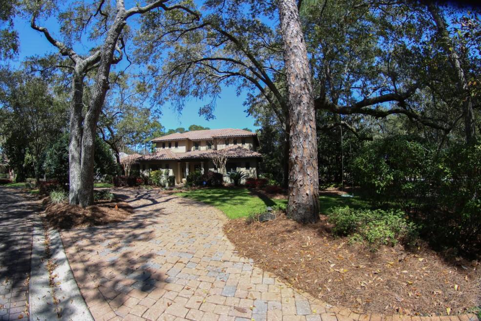 TUCKED SNUGGLY WITH IN THE OAKS NEIGHBORHOOD IN THE PRESTIGIOUS COMMUNITY OF BURNT PINE AT SANDESTIN GOLF AND BEACH RESORT, THIS BEAUTIFUL CUSTOM HOME WELCOMES YOU WITH IT'S WARMTH AND NATURE INSPIRED DECOR. THE MASTER SUITE IS ON THE FIRST FLOOR WITH FRENCH DOORS LEADING TO THE POOL AND SCREENED IN PORCH. UP THE WIDE STAIRCASE WITH WROUGHT IRON RAILING ARE THE 2 GUEST SUITES AND SEPERATE LIVING AREA THAT OVERLOOKS THE POOL AND PRIVATE BACKYARD. NATURAL WOOD FLOORS THROUGHOUT THE FIRST FLOOR OF THE HOME. KITCHEN HAS ALL UPGRADED APPLIANCES WITH A LARGE SUBZERO REFRIGERATOR, 2 BOSCH DISHWASHERS, AND A THERMADOR GAS COOKTOP AND OVEN AS WELL AS A FARM SINK. LIVING ROOM IS ANCHORED BY A BEAUTIFUL LIMESTONE FIREPLACE AND 3 SETS OF FRENCH DOORS OVERLOOKING THE POOL AND PRIVATE BACKYARD.