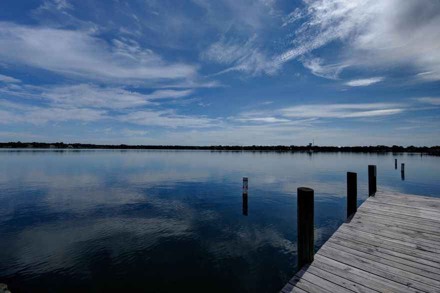 Waterfront townhome on Garniers Bayou!! This unit comes with a boat slip and boat lift.  The owner is having a new roof installed. The first floor has a full bath and bedroom that could also be used for additional living space. The main living area, kitchen and a half bath are on the 2nd floor and the Master Suite, another bedroom and a full bath are located on the 3rd floor. Each level walks out to a covered deck with gorgeous views of Garniers Bayou. Conveniently located, close to both Eglin AFB and Hurlburt Field, shopping, restaurants and the beautiful beaches.  If you dream of being on the water, this could be the place for you.