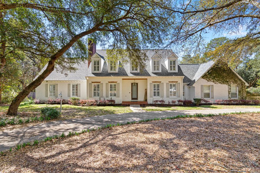 Welcome to 2624 Edgewater Drive in Niceville's Rocky Bayou on the Bayou community. Situated on 1.35 acres beneath mature oak trees, this property offers privacy, space, and access to a bayfront community lot with a short walk to the park.Outdoor living shines with a screened 40,000-gallon pool, multiple deck areas, koi pond, rose garden, and a spacious Florida room featuring a built-in custom indoor hot tub.Inside, hardwood floors, custom shutters, and fully customized closets with built-in cabinetry throughout complement the open layout. The kitchen features Viking and Sub-Zero appliances. The primary suite includes a spa-like bath with hair washing station and dual shower heads.Upgrades include a new roof, updated AC and duct system, solar panels, and whole-home Generac generator.

Heated/cooled basement (not in 4,515 sq ft)--ideal for a theater, game room, or man cave. Potential lot split adds flexibility.