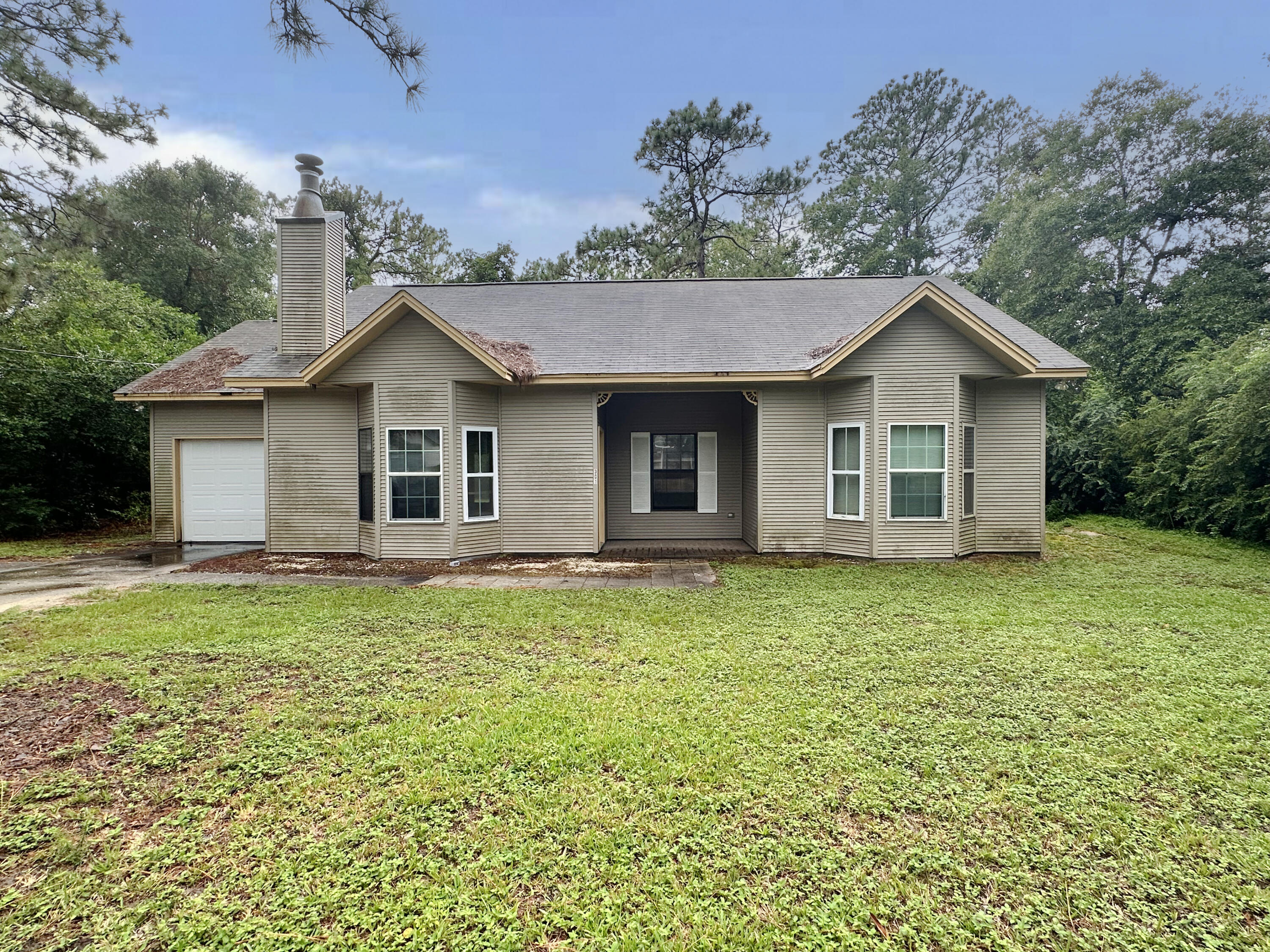 REO. This 3 Bedroom 2 Bath home is located in Central Crestview close to Shopping, Schools and Restaurants! Large Backyard that is fenced and features a Covered Porch. This home has High Ceilings in the Living Area with a Fireplace for cozy evenings this Fall/Winter! Don't miss this opportunity!