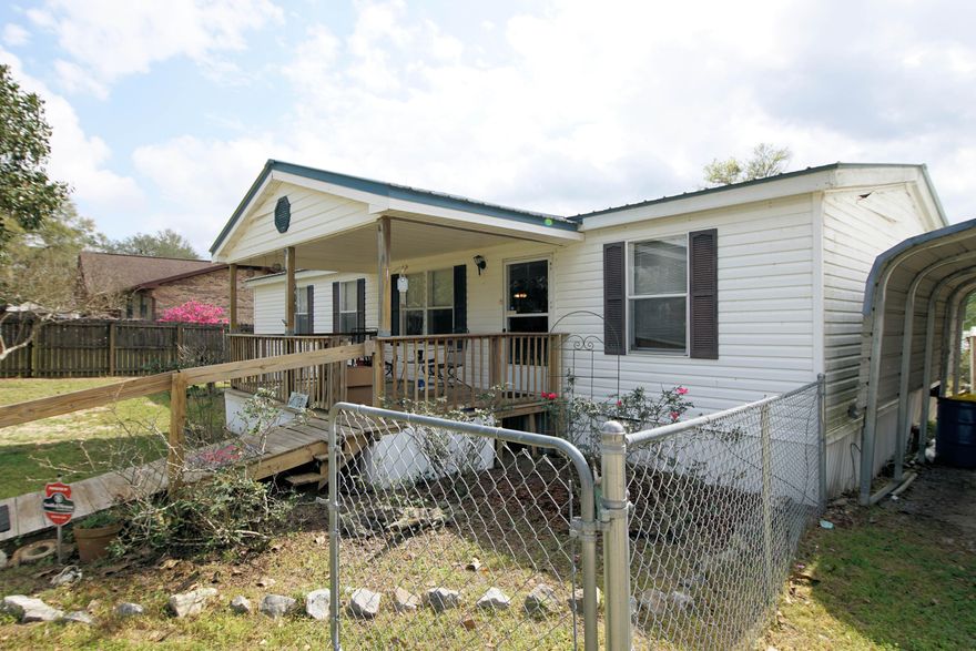 Vacation Rental!! Western sunsets over the beautiful Juniper Lake and perfect Florida weather in this 3 bedroom and 2 bath home with 1296 Sq ft! Built in 1998 this double wide mobile home sits on a double lot with approximately .80 acres of land and 160 feet of water frontage!! This home is perfect for a primary home, secondary/vacation home, or an investment property! The location of this home and dock provides for expansive views of the lake! The exterior of the home has a front, under roof patio (15x10), fenced in yard, three separate carports (12x20) and two sheds (28x20, 10x12)! The possibilities are endless! Build on the second lot, turn the large shed into a short term rental for extra income or add a space for RV parking!  In addition, this property is only minutes to the Juniper Lake Park and public boat ramp! This home has a metal roof and a new heating and cooling system (Bosch, 2022). In addition, there is long dock with a cover for a small boat, sprinkler system, and back porch! Enter the home and notice the vaulted ceilings and open floor plan! The living room opens to the kitchen and dining area! There is also a split floor plan with the master bedroom on one side of the home and the guest bedrooms and bathroom on the other side! The kitchen has a built in microwave, slide in stove and oven, dishwasher and refrigerator. The kitchen cabinets have crown and mirrored doors. The master bedroom has a soaking tub, walk in shower, and double vanity!  Don't miss out on this perfect waterfront home and double lot! Buyer to verify all dimensions and information!