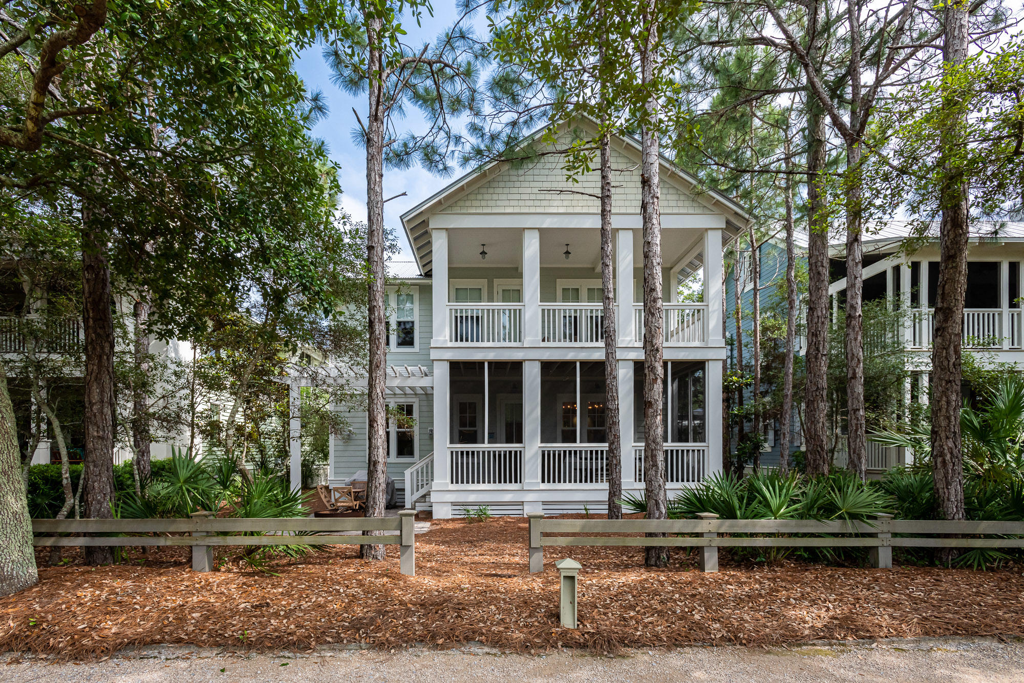 This quintessential 3,097 sq. ft. WaterColor home is prominently located in one of the most desirable locations of Phase II on the green of Camp WaterColor. As you enter the home you are greeted with pine floors throughout, a first-floor master suite with private en suite and separate walk-in shower. The home is accented with 10ft ceilings, shiplap, custom wainscoting, large gracious open living room with luxury interior designed furnishings, large windows with custom window treatments throughout, custom built-in display wall, open dining room with custom interiors, large gourmet chef's kitchen with custom cabinets throughout, stainless steel appliances, and gas cooktop.