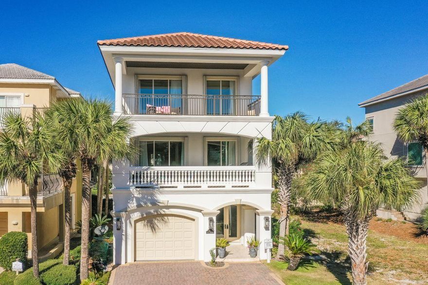 Designed to take full advantage of its exclusive location in Destiny by the Sea, this stunning vacation home offers high-end features with lots of natural light a short stroll from Gulf of Mexico beaches. With three floors of living space, beautiful features abound in this immaculate home, from ornate tray ceilings and elegant columns to stone flooring. The first floor includes a garage, morning kitchen and three bedrooms, including a bunk room. The sweeping wrought iron staircase is a real eye-catcher, connecting all three floors. Second floor living areas are spacious and open.