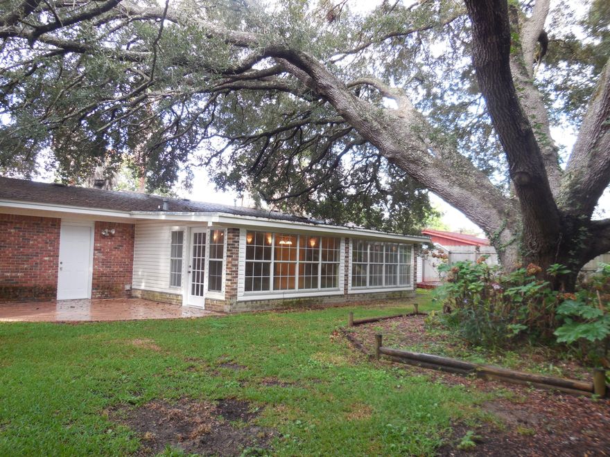 WOW, Great open floor plan with great tiling in the living room, foyer and dining area! The kitchen has a friendly breakfast bar and beautiful brick fireplace in the living room. Step through to a spectacular Florida room large enough for a pool table and then some. In the large backyard you will find one of the biggest and most beautiful live oaks in the county. The master bedroom has two closets and a completely new bath with shower. The guest bath also has a new vanity. All the carpeting is new and the whole house has been newly painted. An oversized garage with laundry hook-up completes the picture. WELCOME HOME! This is a Fannie Mae HomePath property. All appliances as-is. Buyer to verify all information here-in.